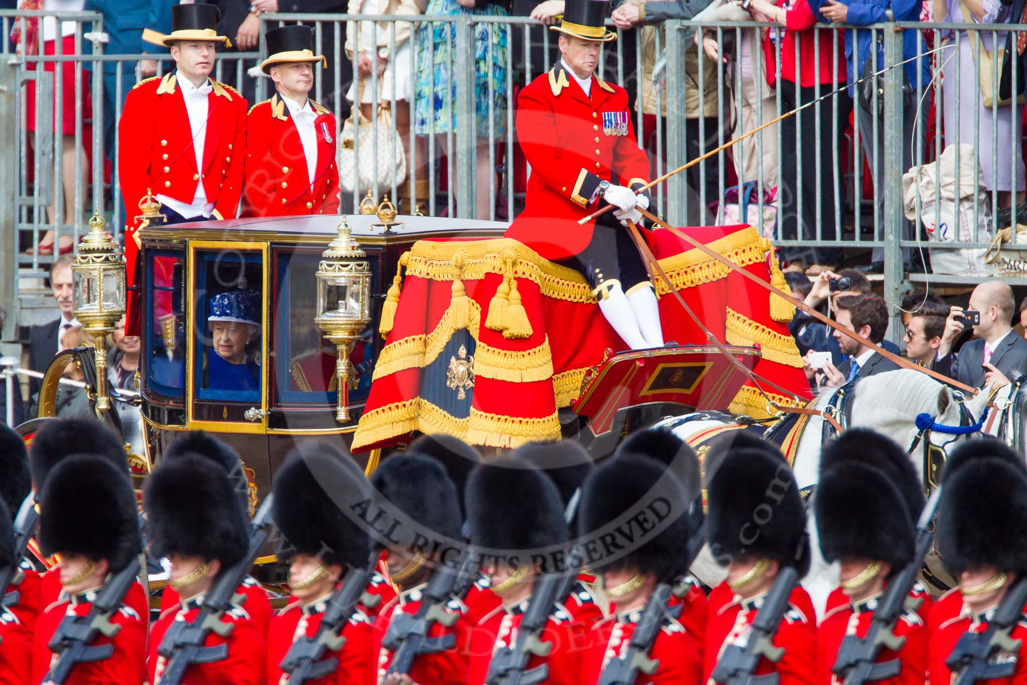 Trooping the Colour 2013: The Glass Coach carrying HM The Queen and HRH The Duke of Kent arrives as Horse Guards Parade, passing No. 6 Guard, No. 7 Company Coldstream Guards..
Horse Guards Parade, Westminster,
London SW1,

United Kingdom,
on 15 June 2013 at 10:58, image #258