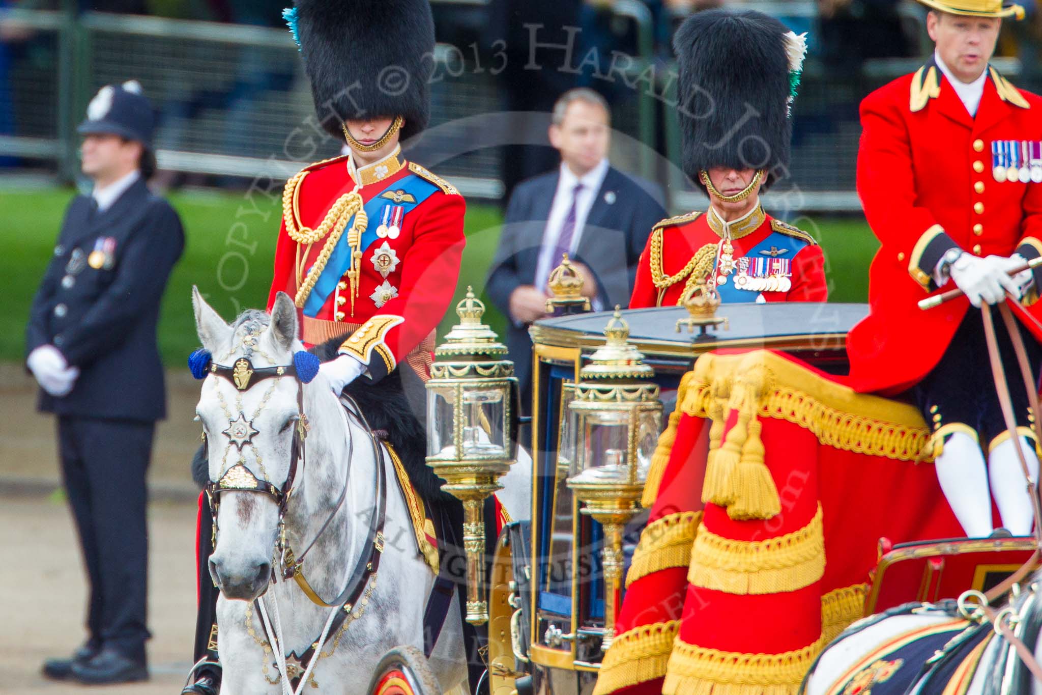 Trooping the Colour 2013: HRH The Duke of Cambridge, Colonel Irish Guards and HRH The Prince of Wales, Colonel Welsh Guards, Royal Colonelsm seen behind the Glass Coach carrying HM The Queen after the Inspection of the Line..
Horse Guards Parade, Westminster,
London SW1,

United Kingdom,
on 15 June 2013 at 11:06, image #358