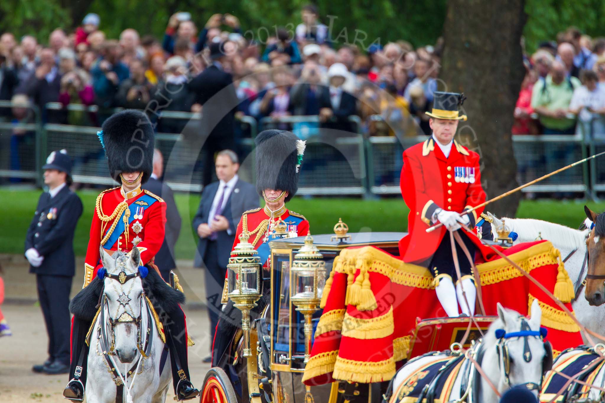 Trooping the Colour 2013: HRH The Duke of Cambridge, Colonel Irish Guards and HRH The Prince of Wales, Colonel Welsh Guards, Royal Colonelsm seen behind the Glass Coach carrying HM The Queen after the Inspection of the Line..
Horse Guards Parade, Westminster,
London SW1,

United Kingdom,
on 15 June 2013 at 11:06, image #359