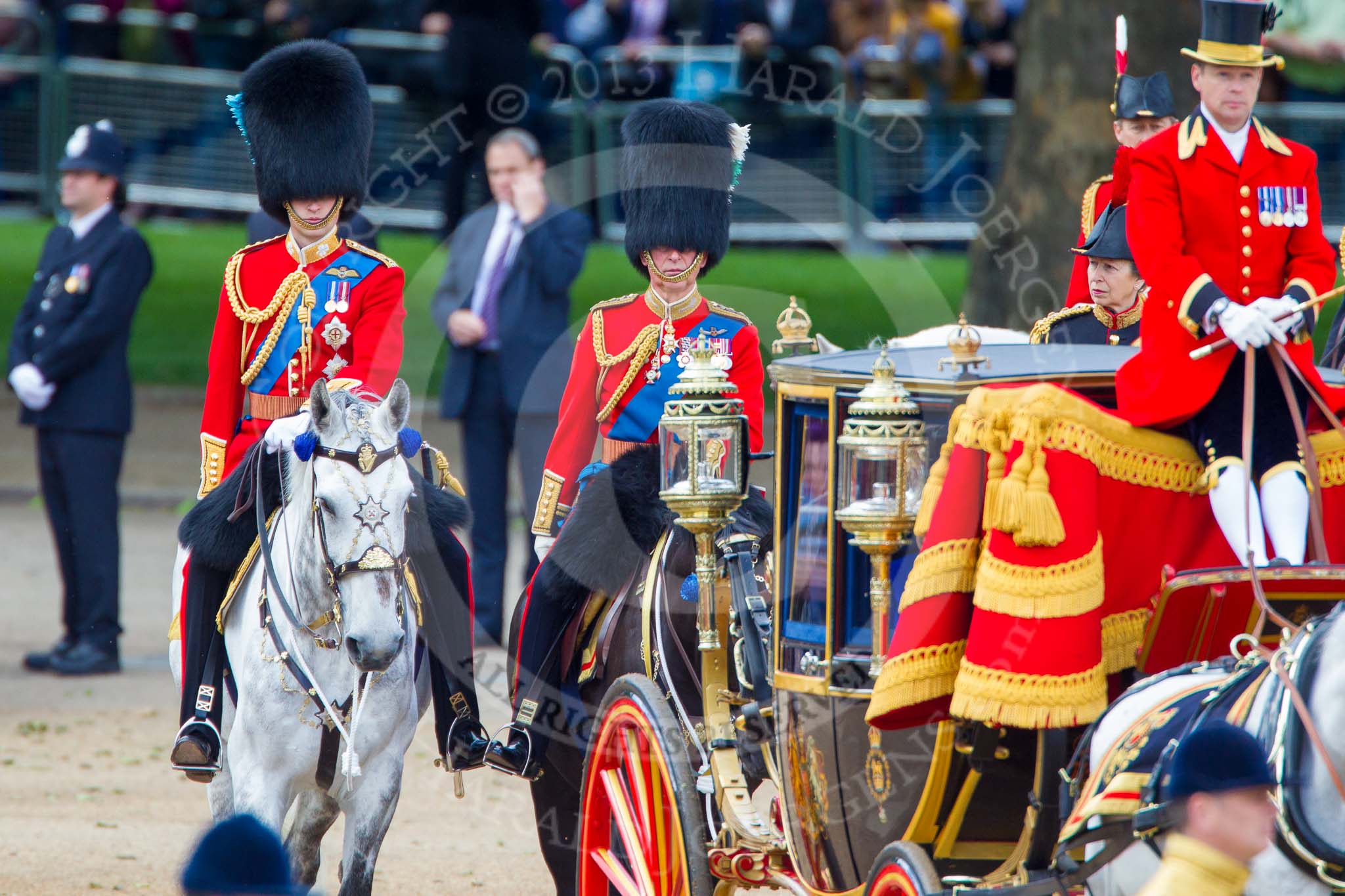 Trooping the Colour 2013: After the Inspection of the Line, the Glass Coach with HM The Queen turns back toward the dais for Her Majesty. Behind the Glass Coach the three Royal Colonels, HRH The Duke of Cambridge, Colonel Irish Guards, HRH The Prince of Wales, Colonel Welsh Guards, and HRH The Princess Royal, Colonel The Blues and Royals (Royal Horse Guards and 1st Dragoons)..
Horse Guards Parade, Westminster,
London SW1,

United Kingdom,
on 15 June 2013 at 11:06, image #360