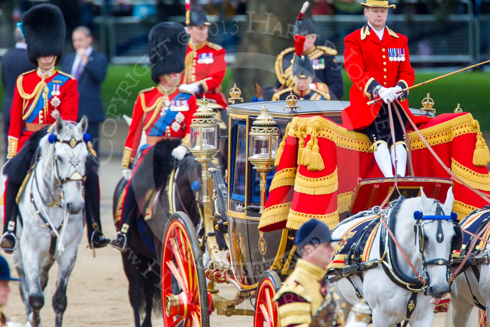 Trooping the Colour 2013: The Glass Coach, carrying HM The Queen, drawn by two Windsor Grey horses, after the Inspection of the Line. Behind, the Royal Colonels and Crown Equerries..
Horse Guards Parade, Westminster,
London SW1,

United Kingdom,
on 15 June 2013 at 11:06, image #361