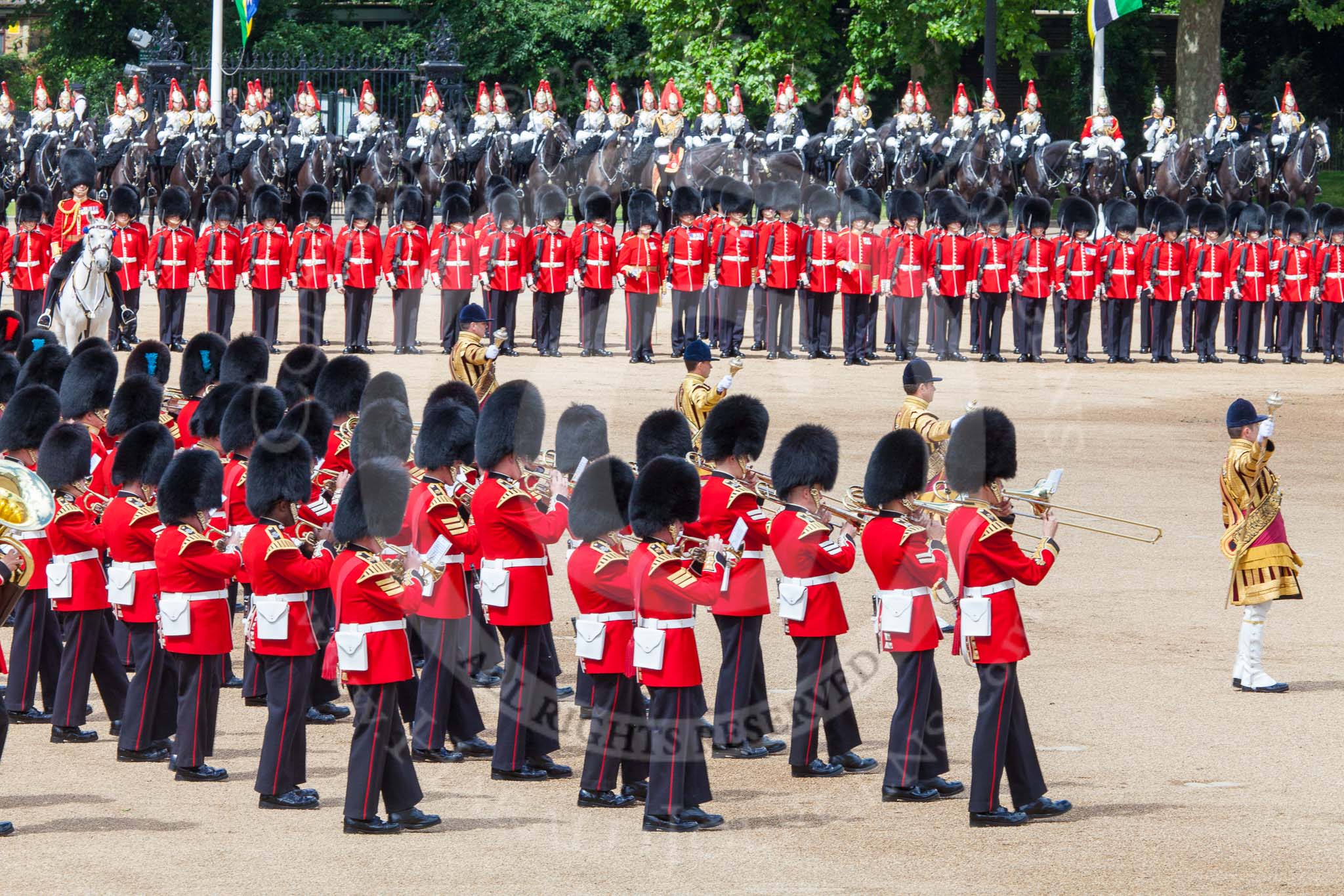 Trooping the Colour 2013: The Massed Band Troop begins with the slow march - the Waltz from Les Huguenots. The Field Offiver, and behind him the Third and Fourth Division of the Sovereign's Escort, The Blues and Royals, can be seen on top of the image. Image #396, 15 June 2013 11:10 Horse Guards Parade, London, UK