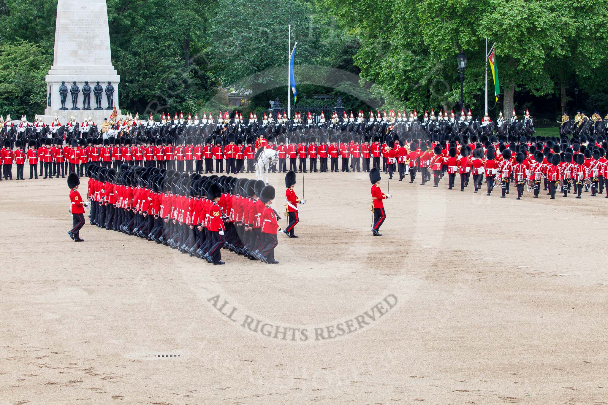 Trooping the Colour 2013: No. 1 Guard (Escort for the Colour),1st Battalion Welsh Guards is about to reveive the Colour. In front the Ensign, Second Lieutenant Joel Dinwiddle, and the Subaltern, Captain F O Lloyd-George. Behind No. 1 Guard the Regimental Sergeant Major, WO1 Martin Topps, Welsh Guards. Image #445, 15 June 2013 11:18 Horse Guards Parade, London, UK