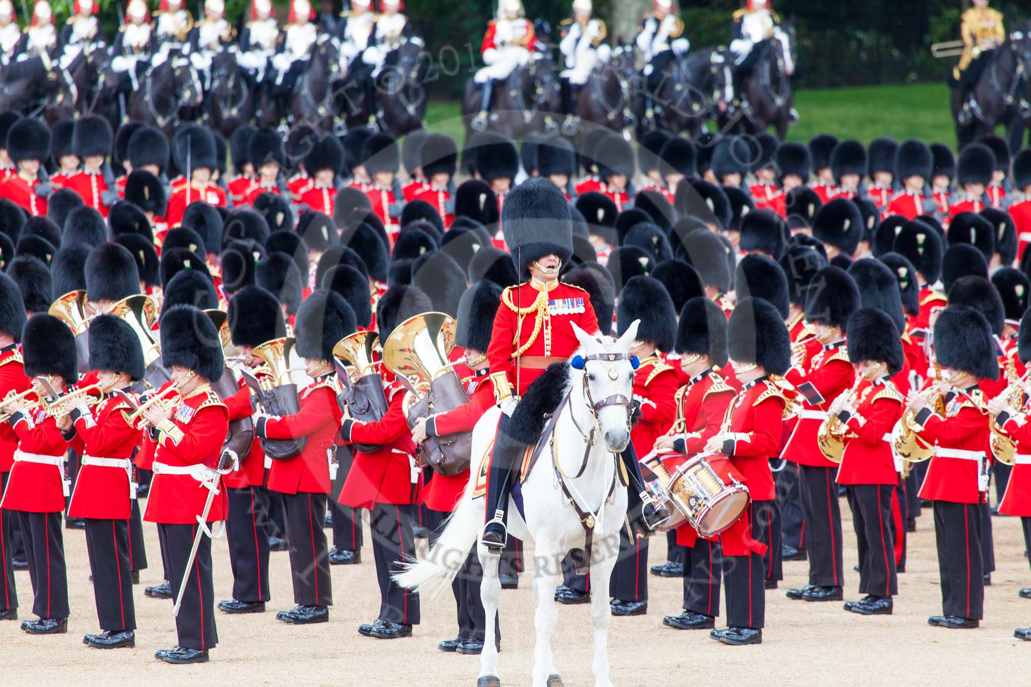 Trooping the Colour 2013: The Field Officer in Brigade Waiting, Lieutenant Colonel Dino Bossi, Welsh Guards, commanding "present arms" as the Escort to the Colour is starting the trooping of the Colour through the ranks. Image #486, 15 June 2013 11:24 Horse Guards Parade, London, UK