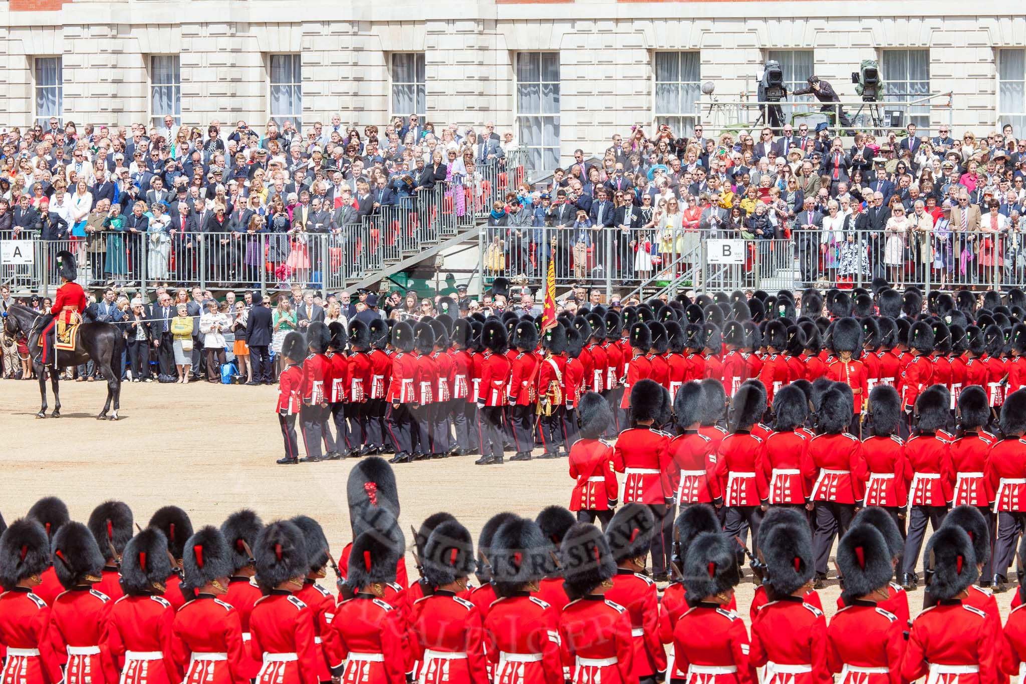Trooping the Colour 2013: The guards change directions in the corners of Horse Guards Parade not by marching around the corner, but by forming new lines of guardsmen at a right angle to the previous direction. Image #557, 15 June 2013 11:39 Horse Guards Parade, London, UK