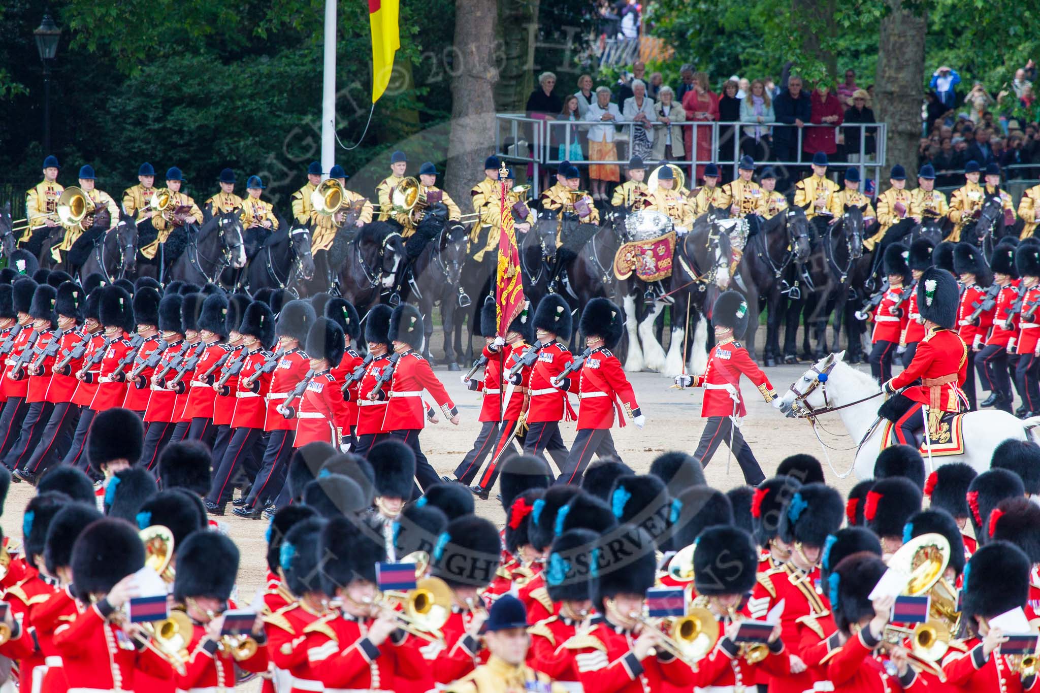Trooping the Colour 2013: No. 1 Guard (Escort for the Colour),1st Battalion Welsh Guards, at the beginning of the March Past in Quick Time. Behind them the Mounted Bands of the Household Cavalry. The Field Officer appears from the right to return to the head of the march past. Image #577, 15 June 2013 11:42 Horse Guards Parade, London, UK
