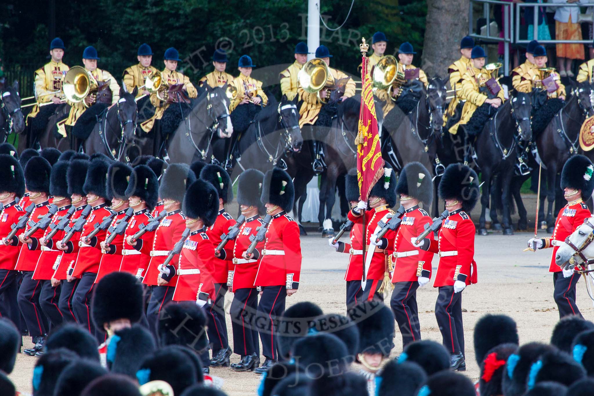 Trooping the Colour 2013: No. 1 Guard (Escort for the Colour),1st Battalion Welsh Guards, at the beginning of the March Past in Quick Time. Behind them the Mounted Bands of the Household Cavalry. Image #578, 15 June 2013 11:42 Horse Guards Parade, London, UK