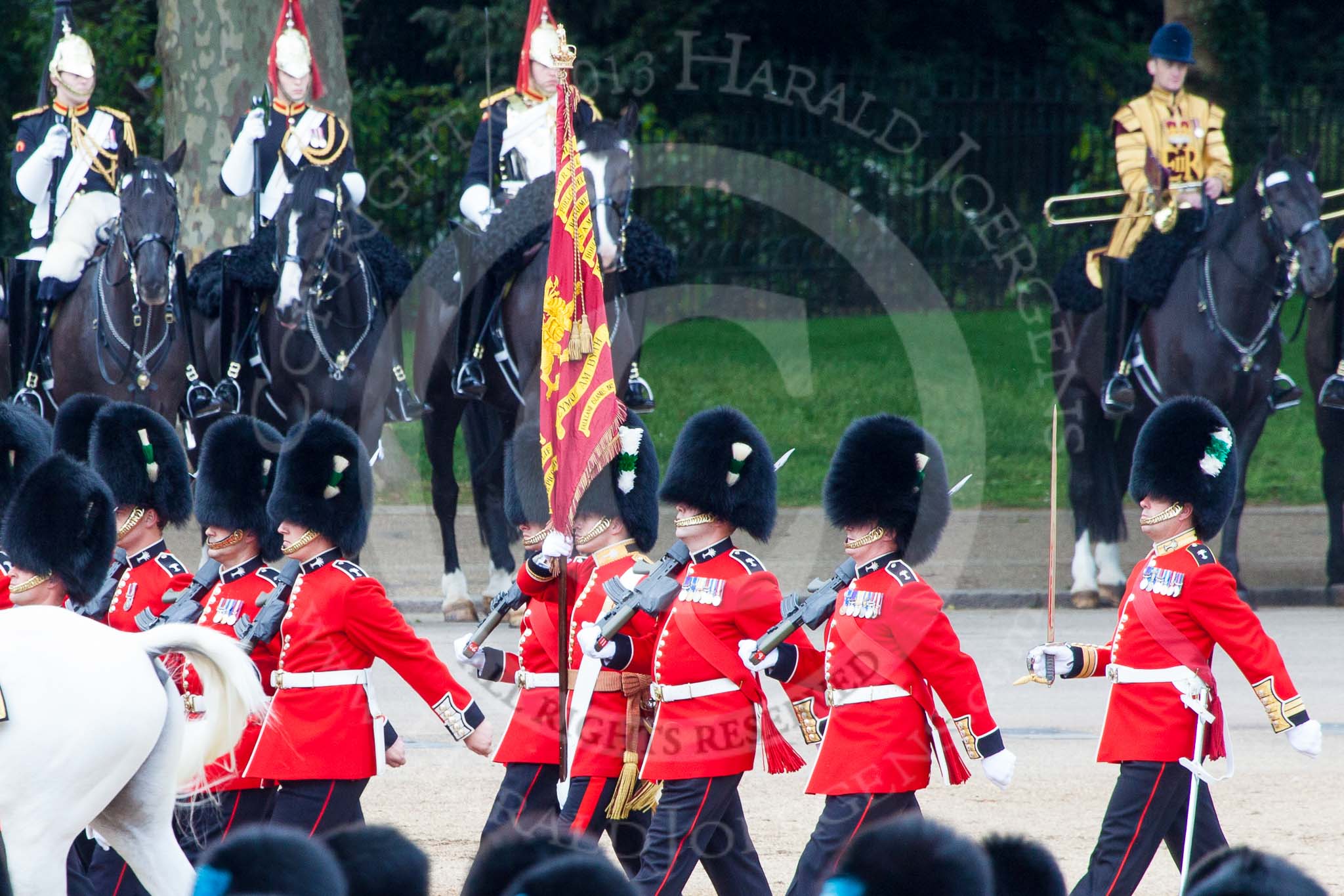 Trooping the Colour 2013: The Ensign, Second Lieutenant Joel Dinwiddle, carrying the Colour during the March past in Quick Time. Image #580, 15 June 2013 11:42 Horse Guards Parade, London, UK