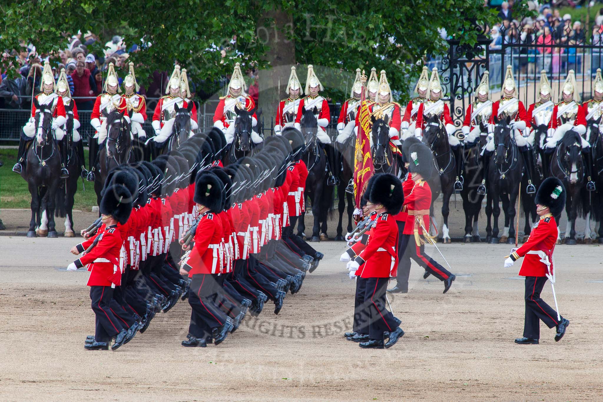 Trooping the Colour 2013: No. 1 Guard (Escort for the Colour),1st Battalion Welsh Guards, during the March Past in Quick Time. Behind them The Life Guards, Household Cavalry. Image #585, 15 June 2013 11:42 Horse Guards Parade, London, UK