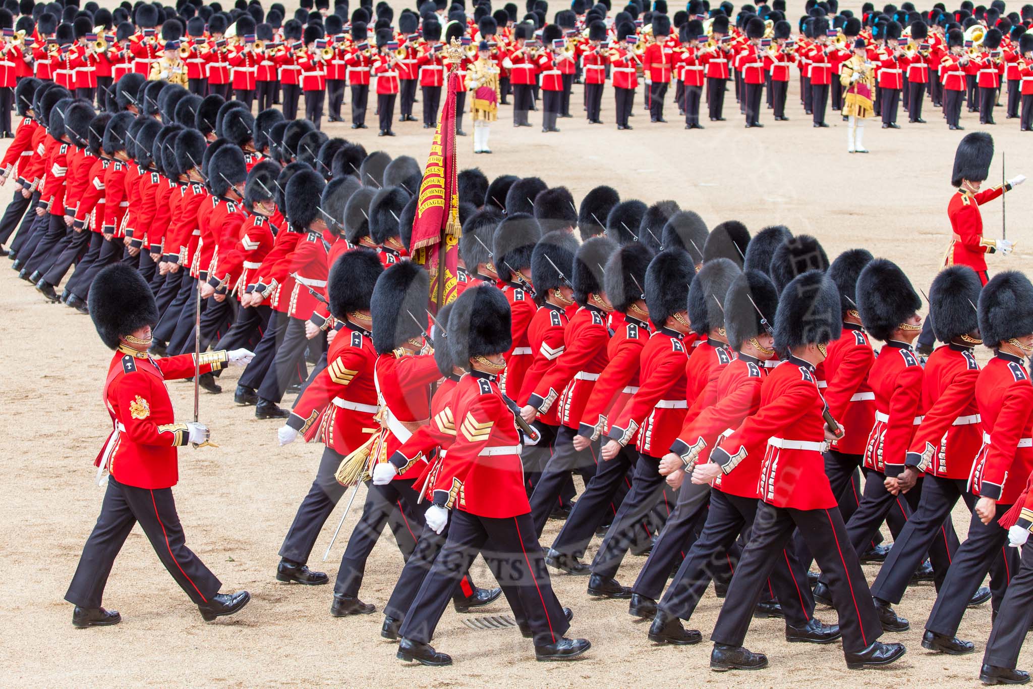 Trooping the Colour 2013: No. 1 Guard, the Escort to the Colour,1st Battalion Welsh Guards, during the March Past in Quick Time. Behind the Ensign is Regimental Sergeant Major, WO1 Martin Topps, Welsh Guards. Image #603, 15 June 2013 11:45 Horse Guards Parade, London, UK