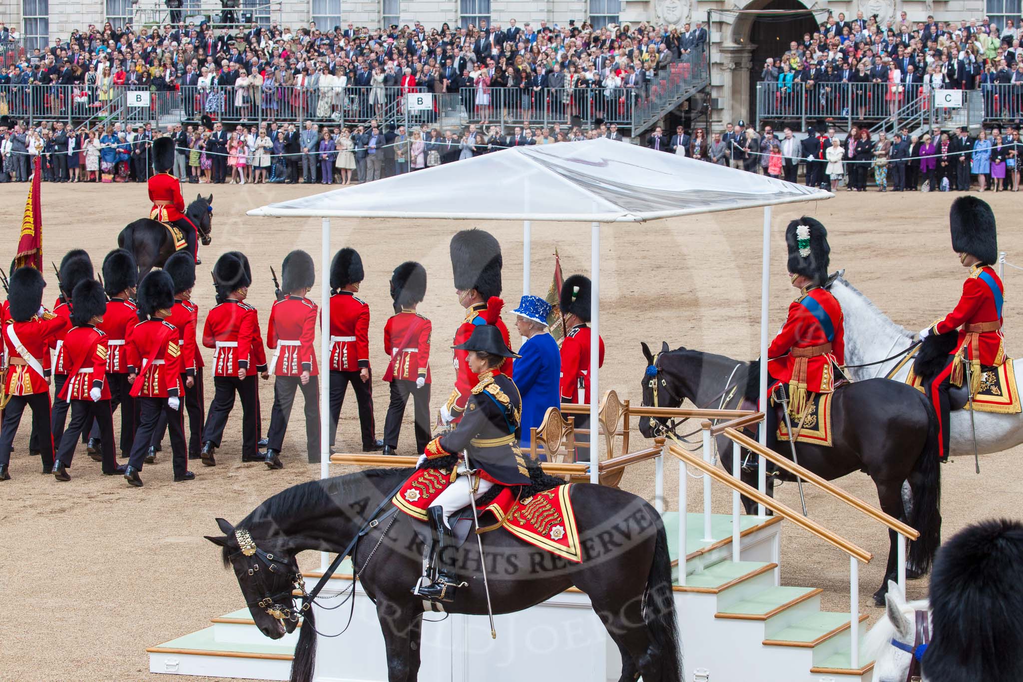 Trooping the Colour 2013: The Royal Colonels, and HRH The Duke of Kent and HM The Queen are standing on the dais, during the March Past. Image #606, 15 June 2013 11:45 Horse Guards Parade, London, UK