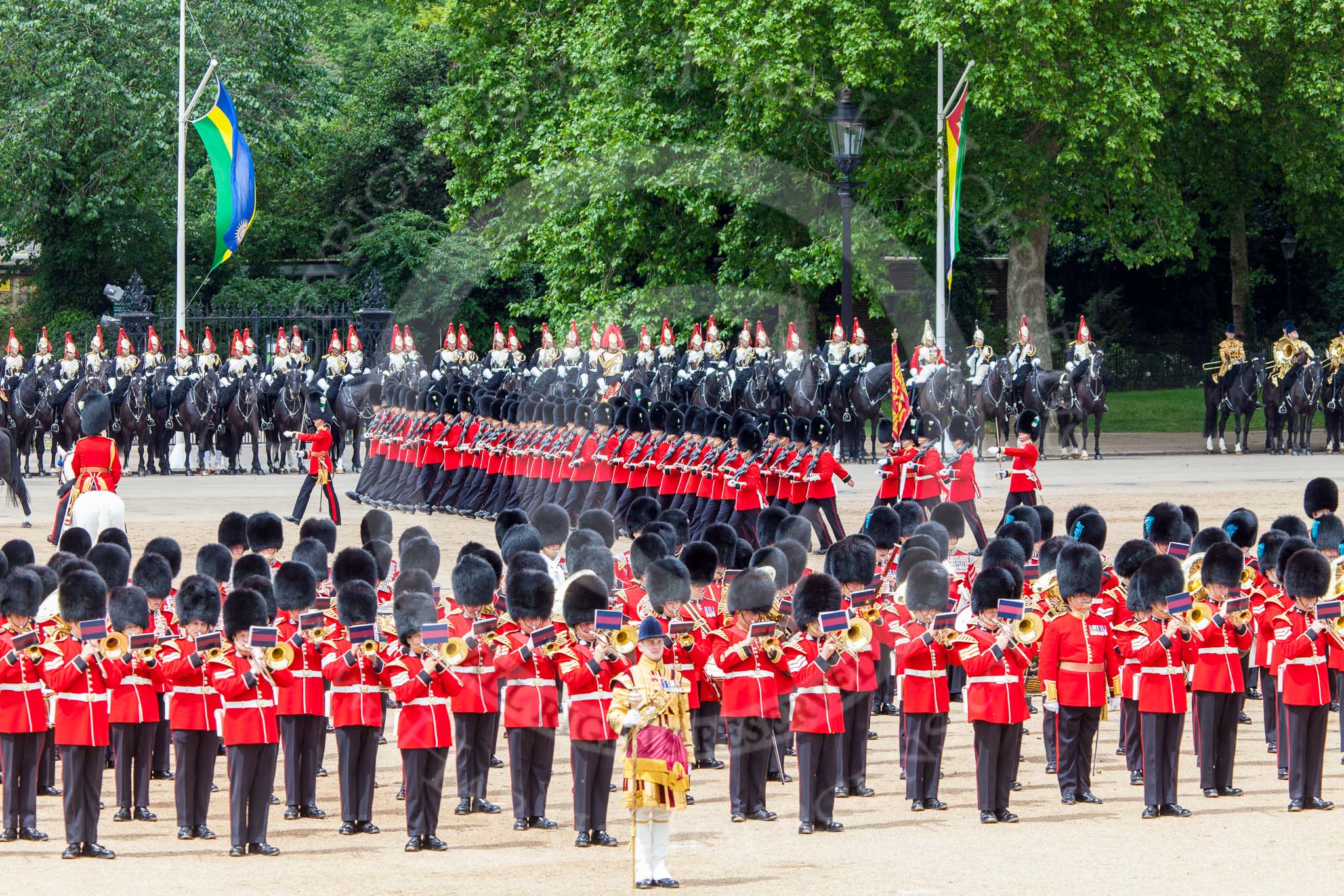 Trooping the Colour 2013: The March Past in Quick Time. The guards are marching beween the Massed Bands, in front, and the Blues and Royals behind them. Image #621, 15 June 2013 11:48 Horse Guards Parade, London, UK
