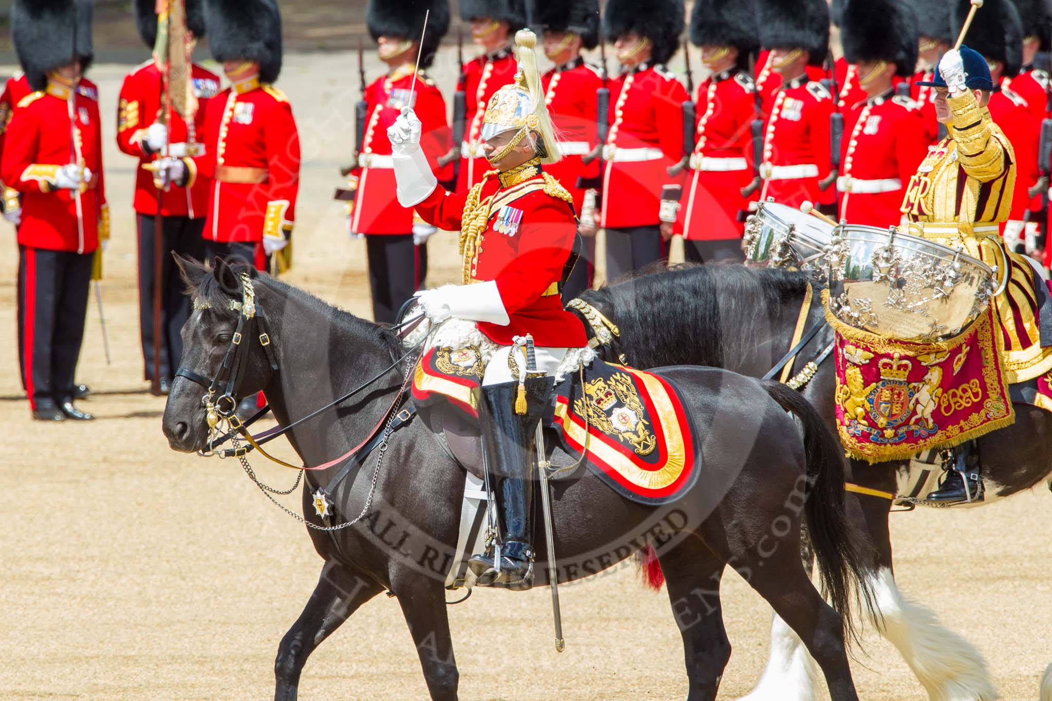 Trooping the Colour 2013: The Ride Past - the Mounted Bands of the Household Cavalry move, from the eastern side, onto Horse Guards Parade. The Director of Music of the Household Cavalry, Major Paul Wilman, The Life Guardsis followed by the kettle drummer from The Life Guards. Image #646, 15 June 2013 11:52 Horse Guards Parade, London, UK