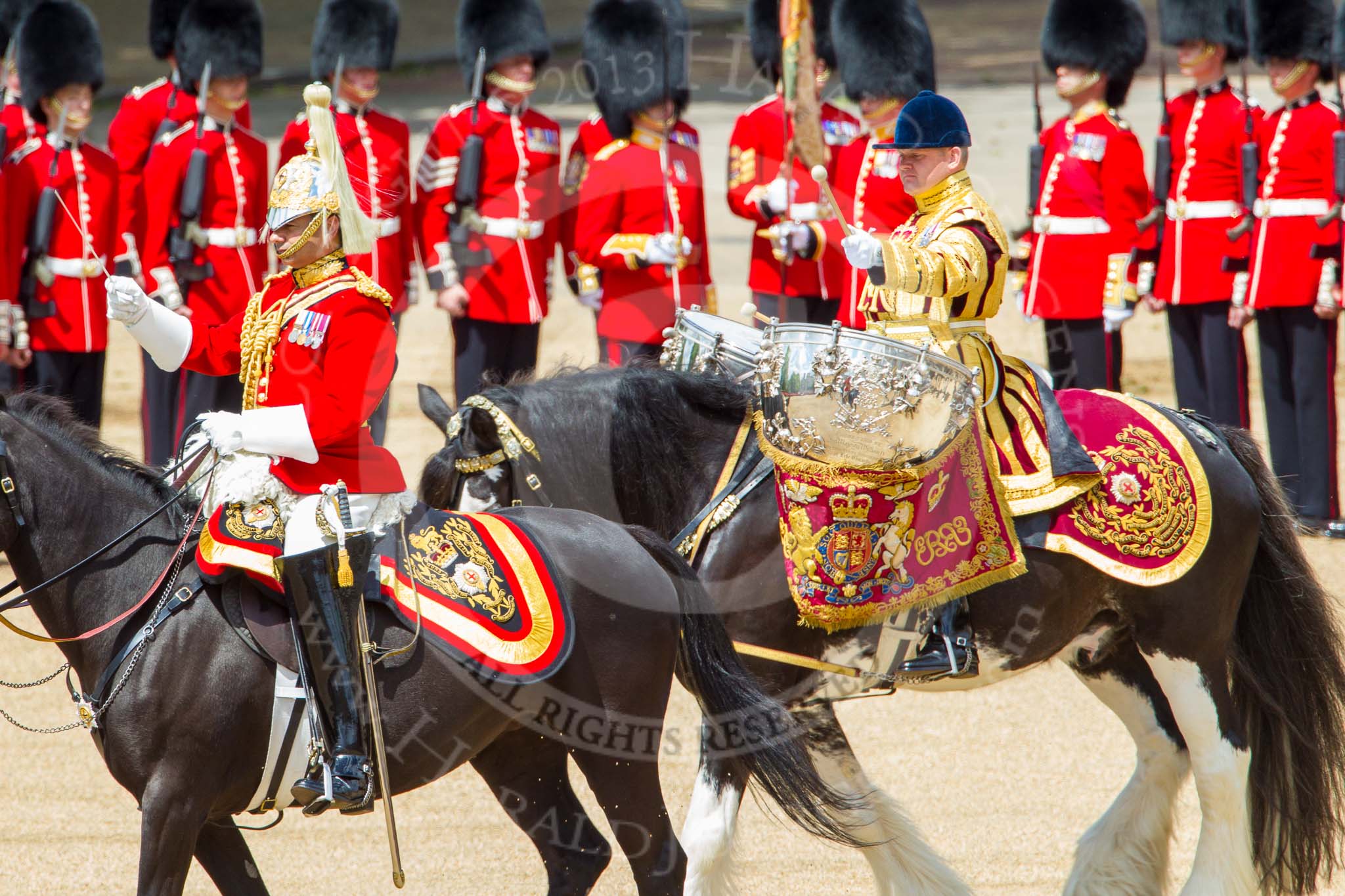 Trooping the Colour 2013: The Ride Past - the Mounted Bands of the Household Cavalry move, from the eastern side, onto Horse Guards Parade. The Director of Music of the Household Cavalry, Major Paul Wilman, The Life Guardsis followed by the kettle drummer from The Life Guards. Image #647, 15 June 2013 11:52 Horse Guards Parade, London, UK