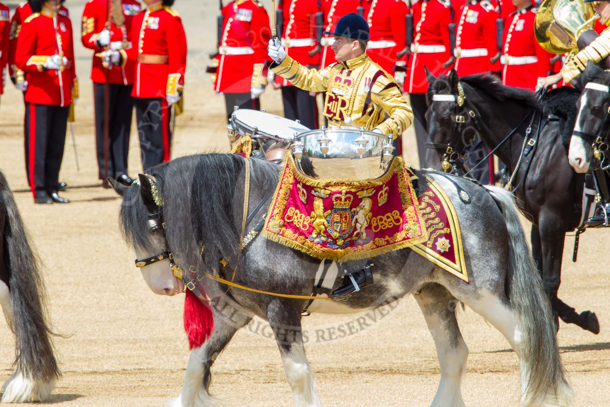 Trooping the Colour 2013: The Ride Past - the Mounted Bands of the Household Cavalry move, from the eastern side, onto Horse Guards Parade. Here the kettle drummer from The Blues and Royals. Image #648, 15 June 2013 11:52 Horse Guards Parade, London, UK