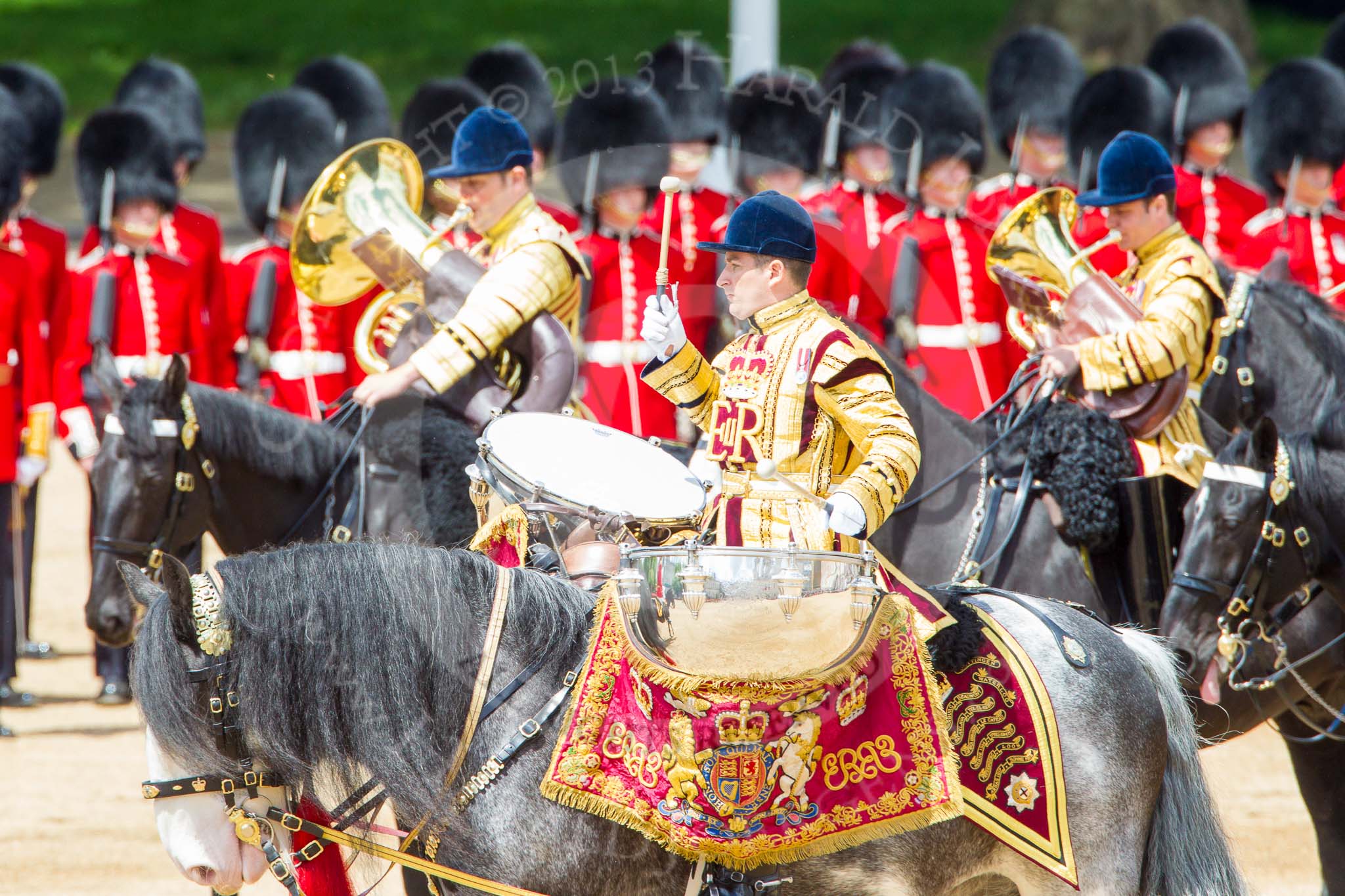 Trooping the Colour 2013: The Ride Past - the Mounted Bands of the Household Cavalry move, from the eastern side, onto Horse Guards Parade. Here the kettle drummer from The Blues and Royals. Image #653, 15 June 2013 11:53 Horse Guards Parade, London, UK
