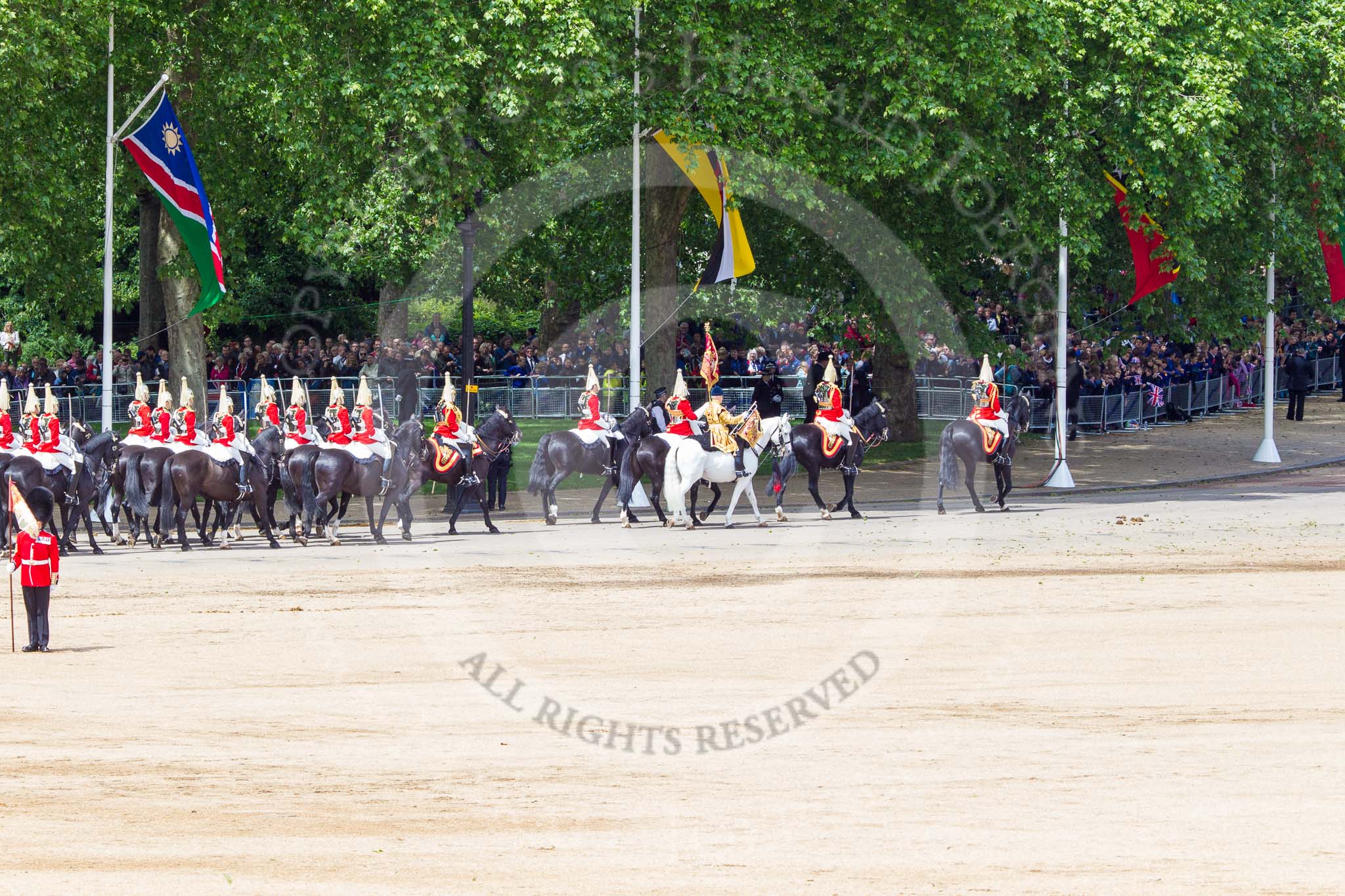Trooping the Colour 2013: The Household Cavalry is marching off, led by the Field Officer of the Escort, Major Nick Stewart, The Life Guards, followed by the Trumpeter, Standard Bearer, Standard Coverer. and The Life Guards as first and second divisions of the Sovereign's Escort. Image #782, 15 June 2013 12:06 Horse Guards Parade, London, UK