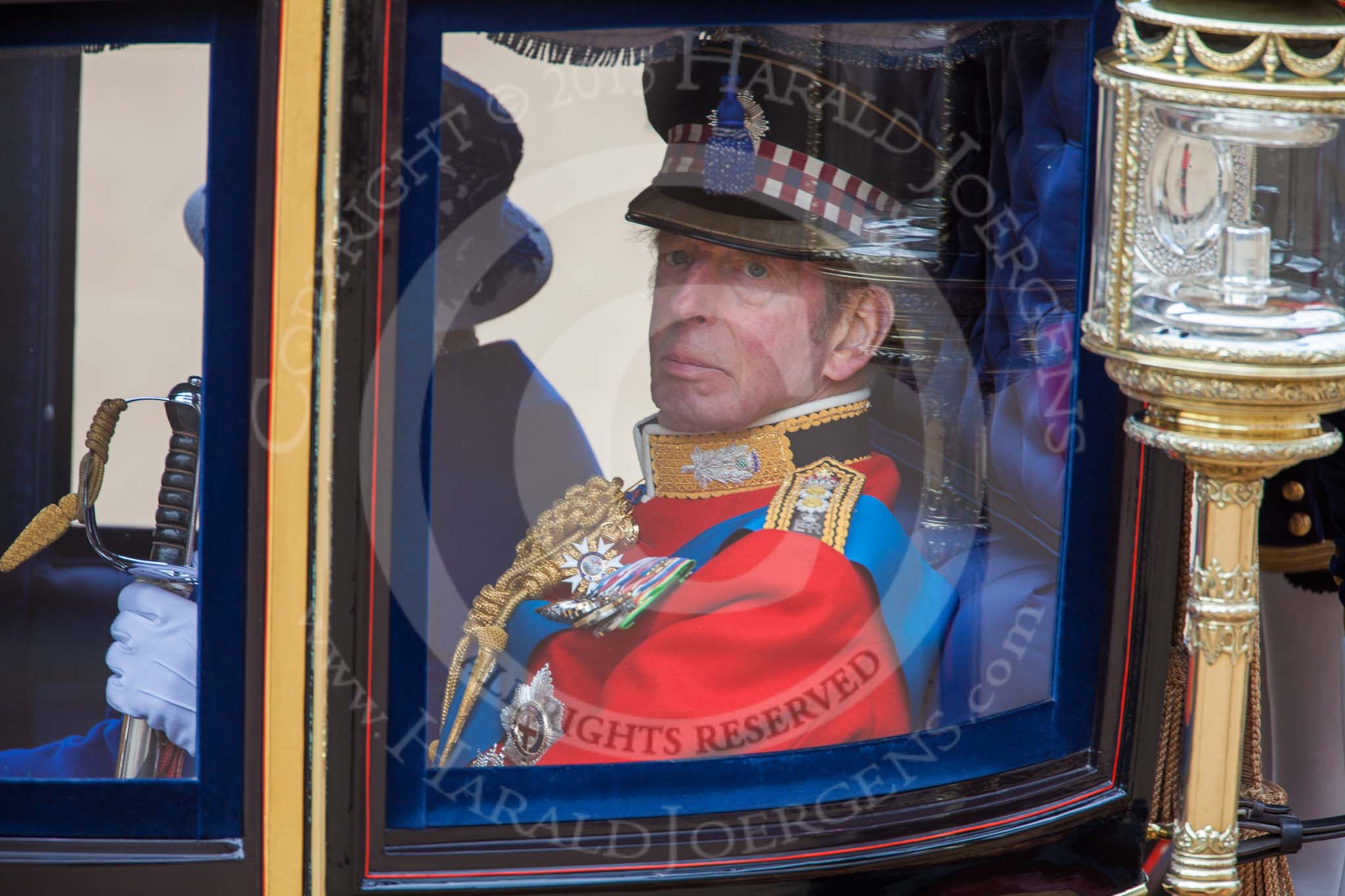 Trooping the Colour 2013: HRH The Duke of Kent and, behind him, HM The Queen and, in the glass coach after the parade. Image #812, 15 June 2013 12:10 Horse Guards Parade, London, UK