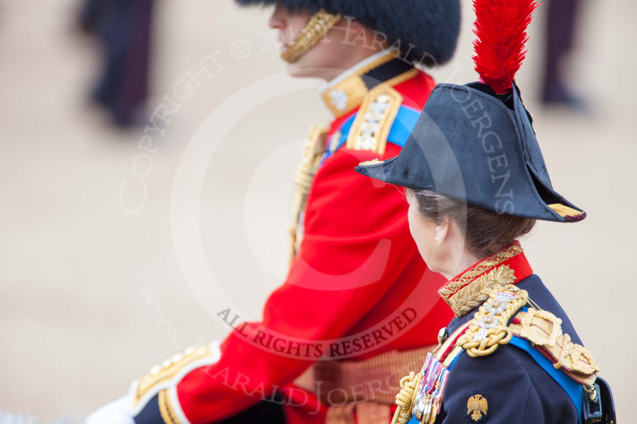 Trooping the Colour 2013: Profile view of two Royal Colonels, HRH The Princess Royal, Colonel The Blues and Royals (Royal Horse Guards and 1st Dragoons), and behind her HRH The Duke of Cambridge, Colonel Irish Guards. Image #813, 15 June 2013 12:10 Horse Guards Parade, London, UK