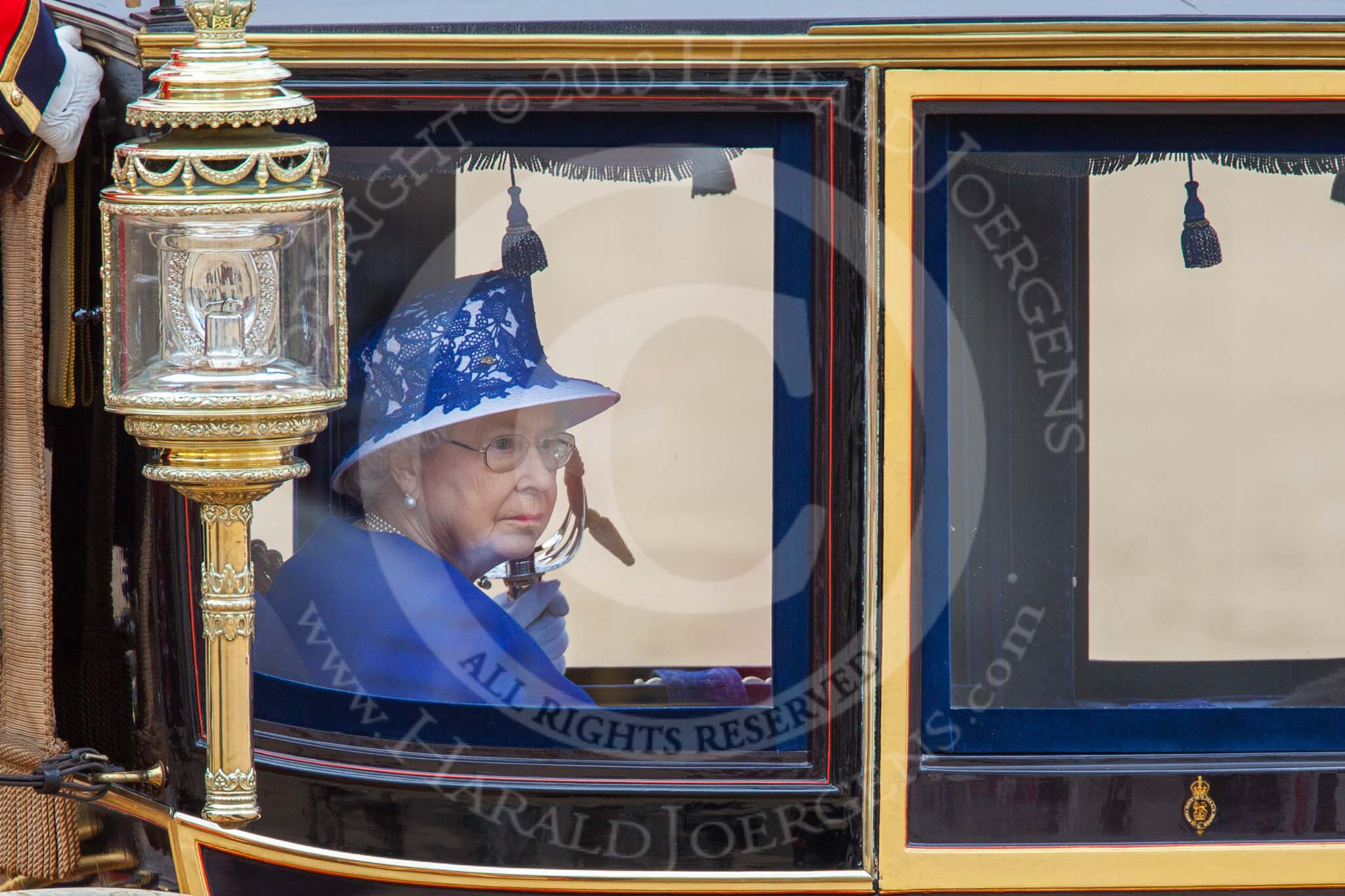 Trooping the Colour 2013: HM The Queen in the glass coach, leaving Horse Guards Parade..
Horse Guards Parade, Westminster,
London SW1,

United Kingdom,
on 15 June 2013 at 12:11, image #819