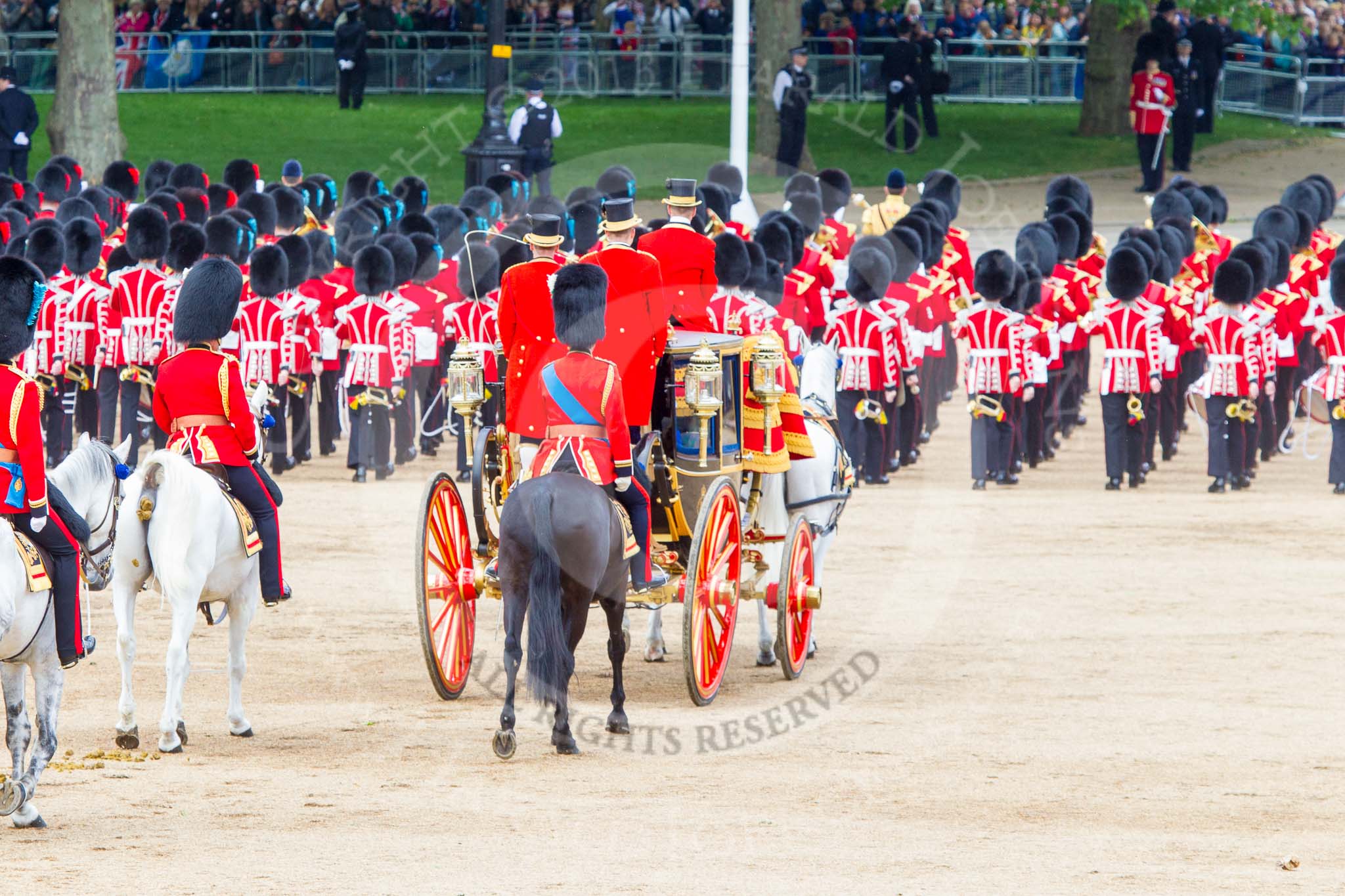 Trooping the Colour 2013: The March Off - the Massed Bands are leaving towards The Mall, followed by the glass coach accying HM The Queen and HRH The Duke of Kent. Behind the glass coach the Royal Colonels. Image #826, 15 June 2013 12:11 Horse Guards Parade, London, UK