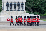 Trooping the Colour 2013: The 'Keepers of the Ground', guardsmen bearing marker flags for their respective regiments, turning towards Horse Guards Parade at the Guards Memorial. Image #25, 15 June 2013 09:53 Horse Guards Parade, London, UK