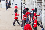 Trooping the Colour 2013: The 'Keepers of the Ground', guardsmen bearing marker flags for their respective regiments, disappearing under Horse Guards Arch, they will return later to mark the positions for their regiments. Image #27, 15 June 2013 09:55 Horse Guards Parade, London, UK