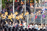 Trooping the Colour 2013: The Mounted Bands of the Household Cavalry are marching down Horse Guards Road as the third element of the Royal Procession, taking position at the northern side of Horse Guards Parade, next to St James's Park. The Glass Coach of HM The Queen can just be seen arriving from The Mall. Image #240, 15 June 2013 10:56 Horse Guards Parade, London, UK