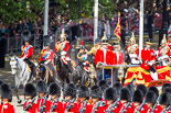 Trooping the Colour 2013: The Glass Coach carrying HM The Queen arrives at Horse Guards Parade. Behind three Royal Colonels, HRH The Duke of Cambridge, HRH The Prince of Wales, and HRH The Princess Royal. Behind them the Field Officer of the Escort, the Escort Commander, Standard Coverer, Standard Bearer, and Trumpeter. Image #254, 15 June 2013 10:58 Horse Guards Parade, London, UK
