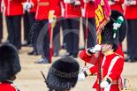 Trooping the Colour 2013: The Ensign, Second Lieutenant Joel Dinwiddle, marches foreward with the Colour, whilst Regimental Sergeant Major, WO1 Martin Topps, Welsh Guards, behind the Ensign, sword drawn, returns to the Escort to the Colour. Image #471, 15 June 2013 11:22 Horse Guards Parade, London, UK