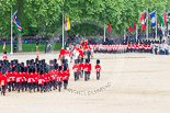 Trooping the Colour 2013: The March Off - the Massed Bands are leaving towards The Mall, followed by the glass coach carrying HM The Queen and HRH The Duke of Kent. Behind members of the Royal Procession, followed by No. 1 Guard, carrying the Colour. Image #845, 15 June 2013 12:12 Horse Guards Parade, London, UK