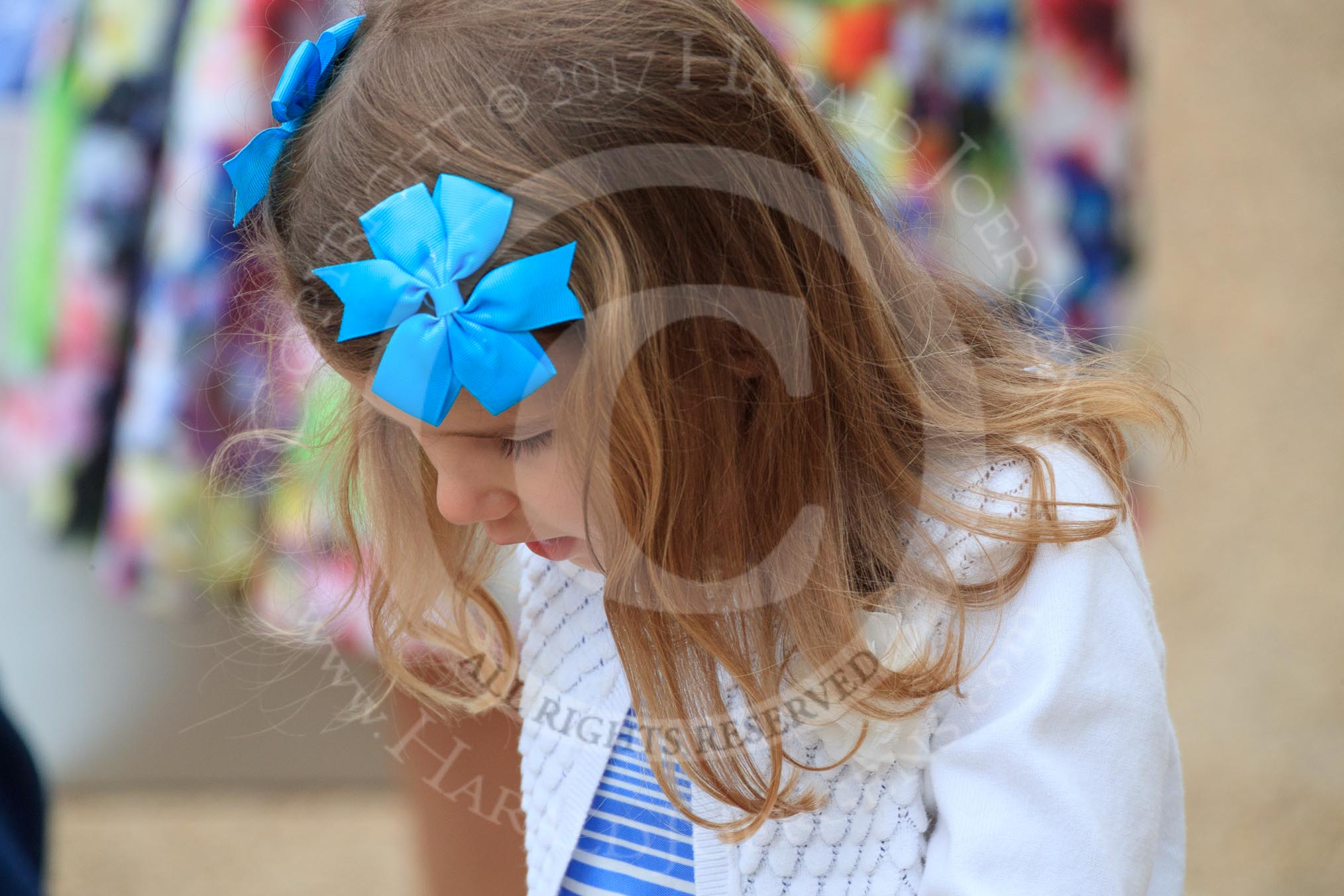 Young female spectator before The Colonel's Review 2018 (final rehearsal for Trooping the Colour, The Queen's Birthday Parade)  at Horse Guards Parade, Westminster, London, 2 June 2018, 09:11.
