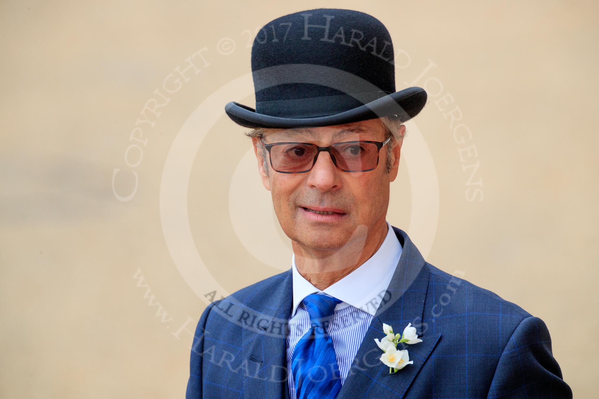 A quintessentially British spectator, wearing a suit and bowler hat, before The Colonel's Review 2018 (final rehearsal for Trooping the Colour, The Queen's Birthday Parade)  at Horse Guards Parade, Westminster, London, 2 June 2018, 10:11.