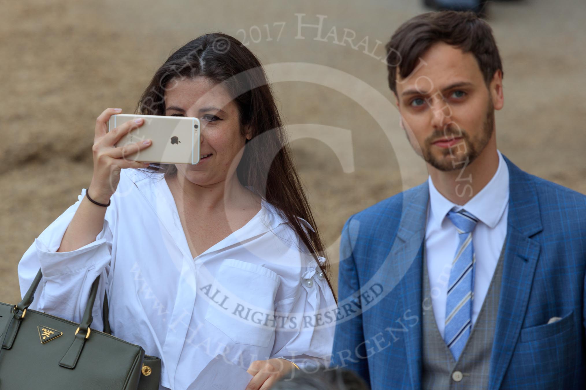 Well dressed couple arriving at Hprse Guards Parade for The Colonel's Review 2018 (final rehearsal for Trooping the Colour, The Queen's Birthday Parade)  at Horse Guards Parade, Westminster, London, 2 June 2018, 10:13.