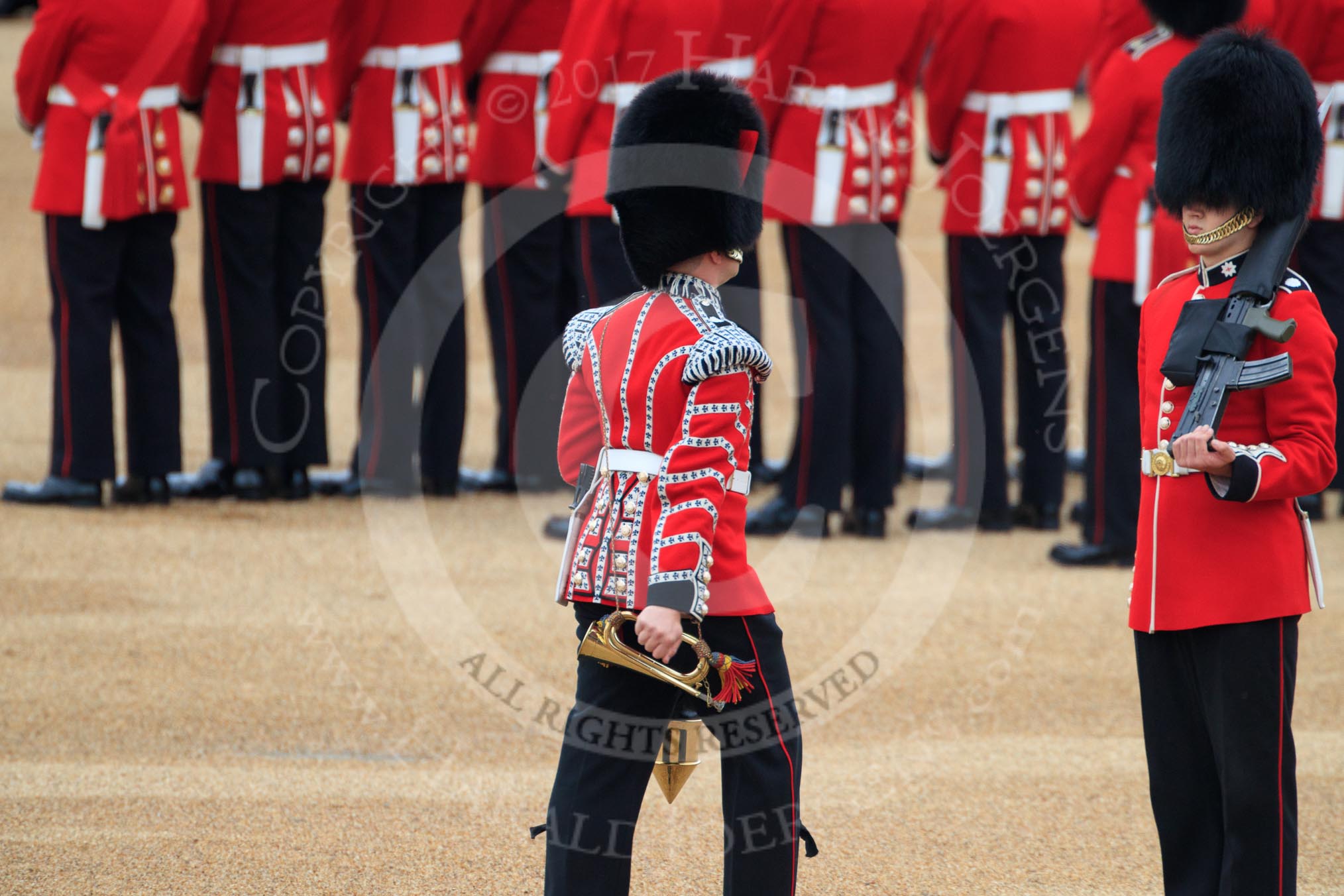 Duty Drummer Sam Orchard marching off with the Colour case, behind him Colour Sentry Guardsman Jonathon Hughes (26), during The Colonel's Review 2018 (final rehearsal for Trooping the Colour, The Queen's Birthday Parade)  at Horse Guards Parade, Westminster, London, 2 June 2018, 10:34.
