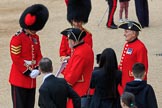 A Coldstream Guards Sergeant and Captain welcoming Chelsea Pensioners before The Colonel's Review 2018 (final rehearsal for Trooping the Colour, The Queen's Birthday Parade)  at Horse Guards Parade, Westminster, London, 2 June 2018, 09:19.