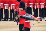Duty Drummer  Sam Orchard uncasing the Colour. Behind him Colour Sentry Guardsman Jonathon Hughes (26) during The Colonel's Review 2018 (final rehearsal for Trooping the Colour, The Queen's Birthday Parade)  at Horse Guards Parade, Westminster, London, 2 June 2018, 10:33.