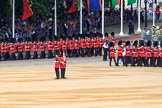 Number Six Guard, F Company, Scots Guards, on the right, is immediately followed by Number Five Guard, Nijmegen Company, Grenadier Guards, here marching past the Youth Enclosure during Trooping the Colour 2018, The Queen's Birthday Parade at Horse Guards Parade, Westminster, London, 9 June 2018, 10:25.