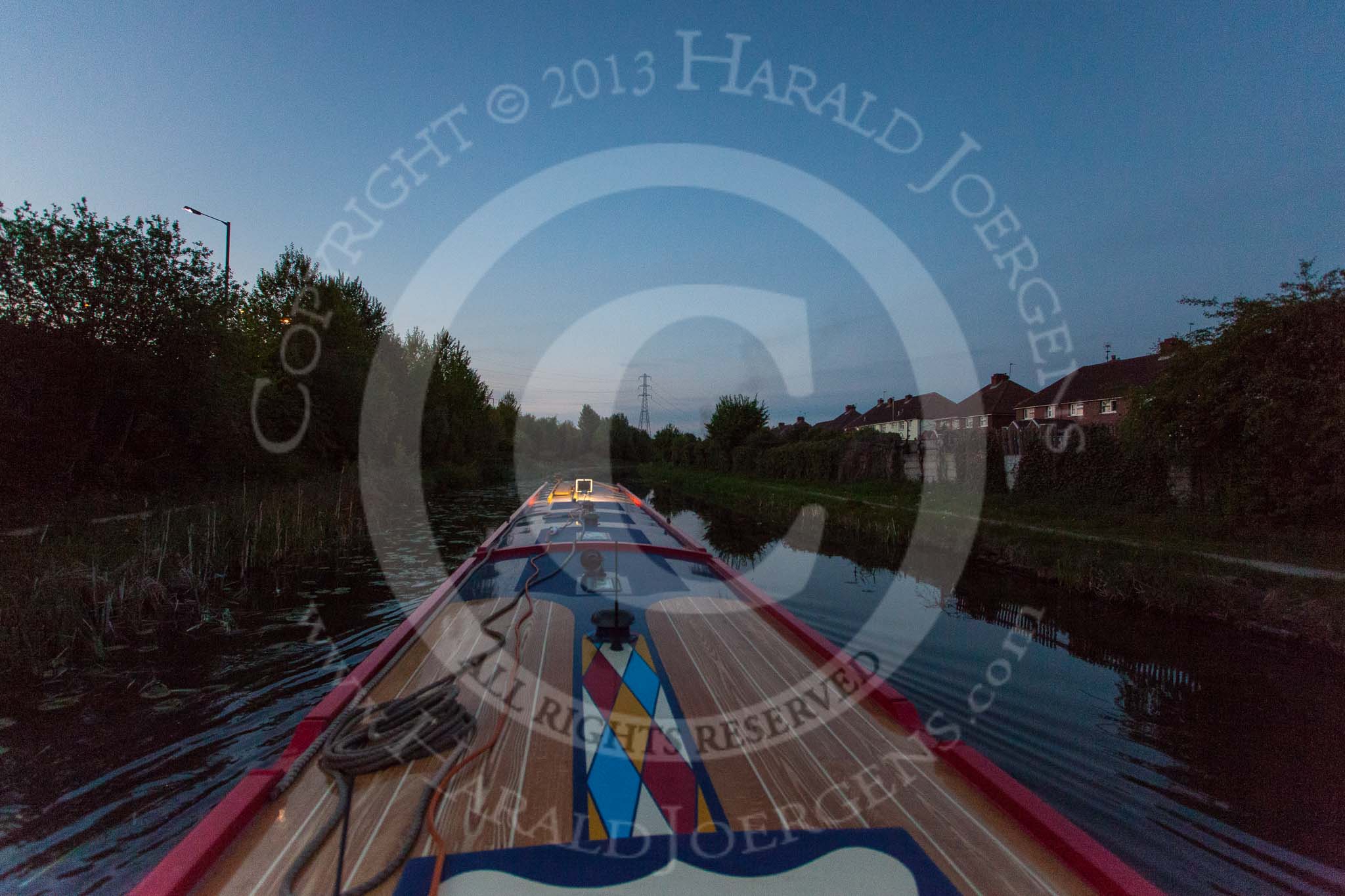 BCN Marathon Challenge 2013: NB "Folinious Mongoose", in fading daylight at 9:30pm, on the Walsall Canal at Darlaston, between Midland Road and Wolverhampton Street, with the houses at Lowe  Avenue on the right..
Birmingham Canal Navigation,


United Kingdom,
on 25 May 2013 at 21:29, image #315