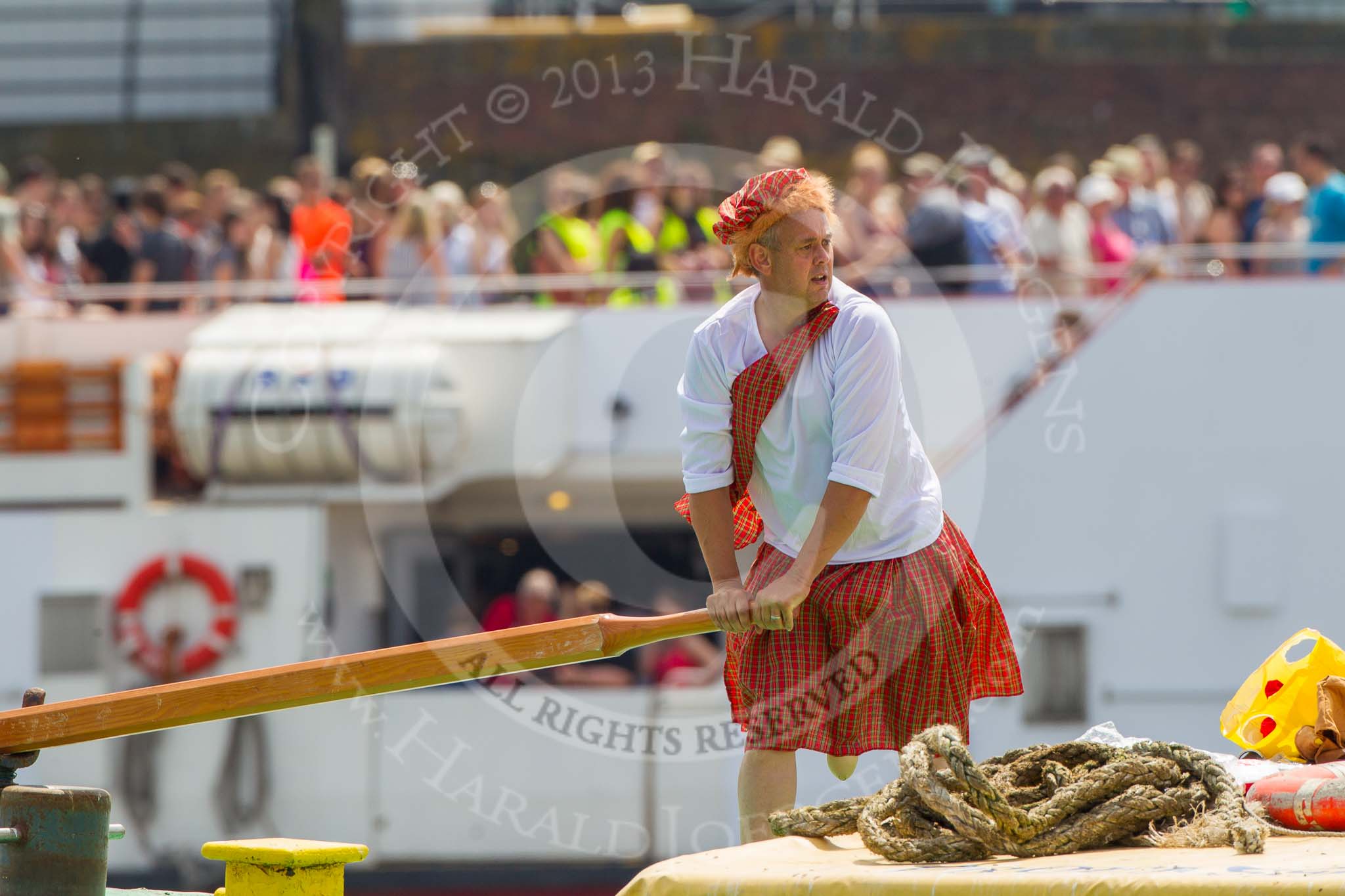 TOW River Thames Barge Driving Race 2013: Steerer wearing skirts on the deck of of barge "Hoppy" by GPS Fabrication..
River Thames between Greenwich and Westminster,
London,

United Kingdom,
on 13 July 2013 at 12:36, image #126