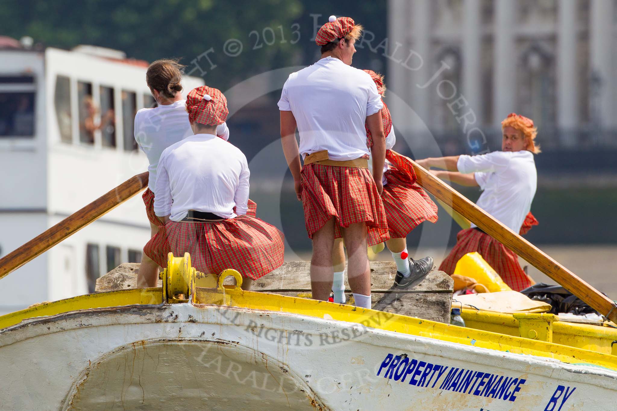 TOW River Thames Barge Driving Race 2013: Rowers wearing skirts on the deck of of barge "Hoppy" by GPS Fabrication..
River Thames between Greenwich and Westminster,
London,

United Kingdom,
on 13 July 2013 at 12:38, image #137