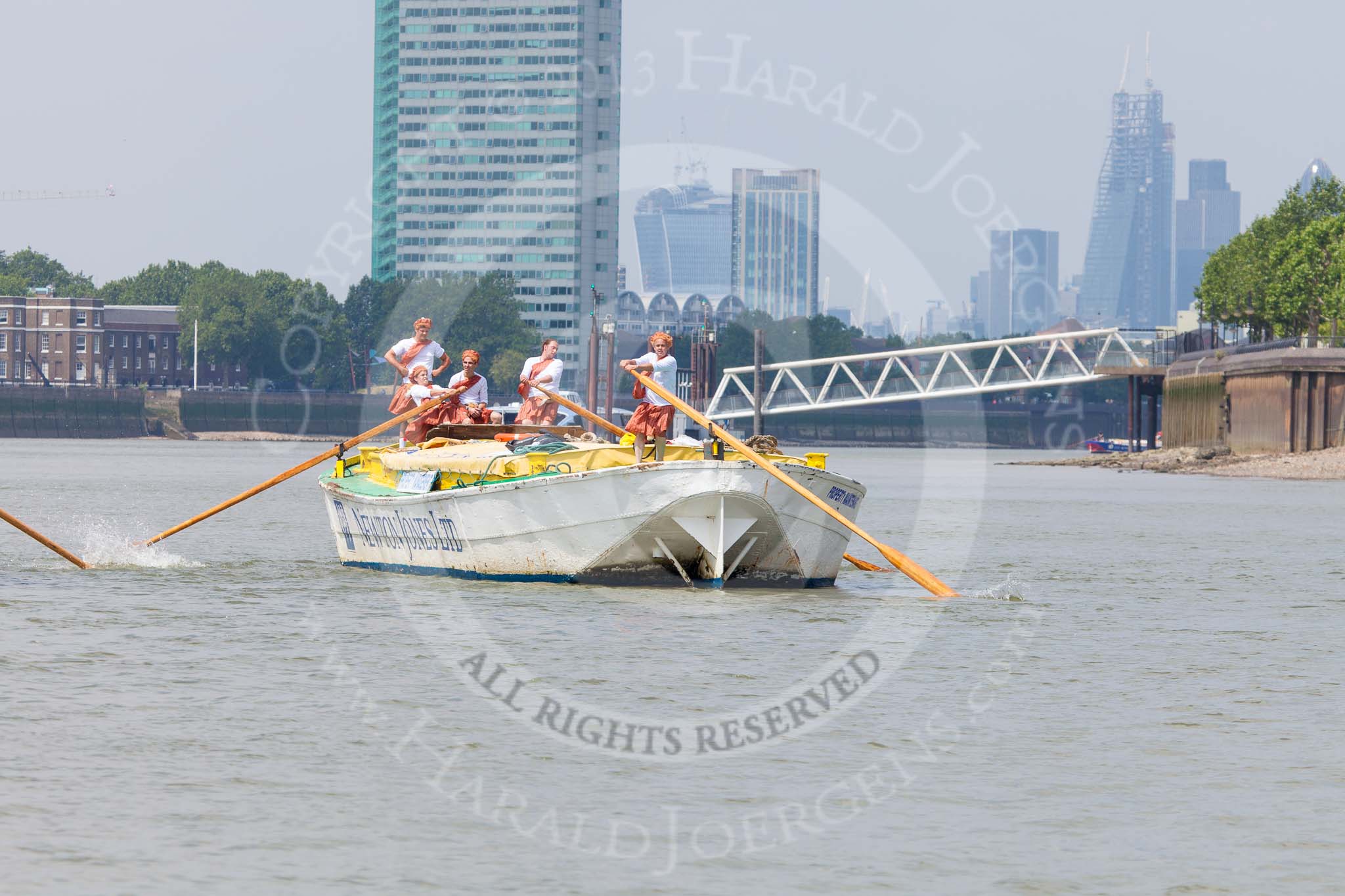 TOW River Thames Barge Driving Race 2013: Barge "Hoppy", by GPS Fabrication, approaching Masthouse Terrace Pier. On the left, only an oar can be seen of barge "Spirit of Mountabatten", by Mechanical Movements and Enabling Services Ltd. In the background the skyscrapers of the City of London..
River Thames between Greenwich and Westminster,
London,

United Kingdom,
on 13 July 2013 at 12:41, image #166