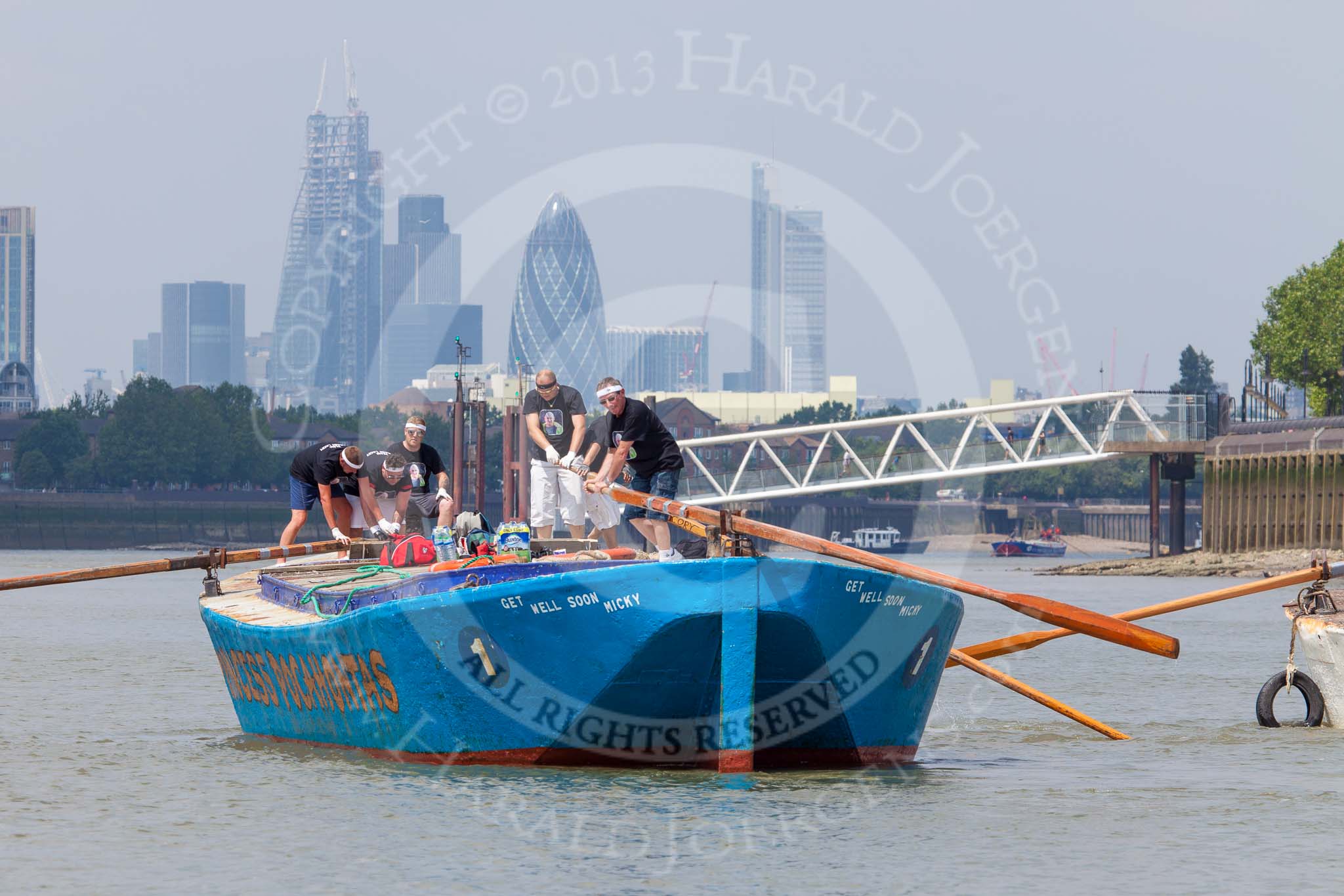 TOW River Thames Barge Driving Race 2013: Rear view of barge "Darren Lacey", by Princess Pocahontas, during the race, approaching Masthouse Terrace Pier. In the background the skyscrapers of the City of London, including the "Gherkin". On the right of "Darren Lacey" is barge "Spirit of Mountabatten", by Mechanical Movements and Enabling Services Ltd..
River Thames between Greenwich and Westminster,
London,

United Kingdom,
on 13 July 2013 at 12:41, image #176