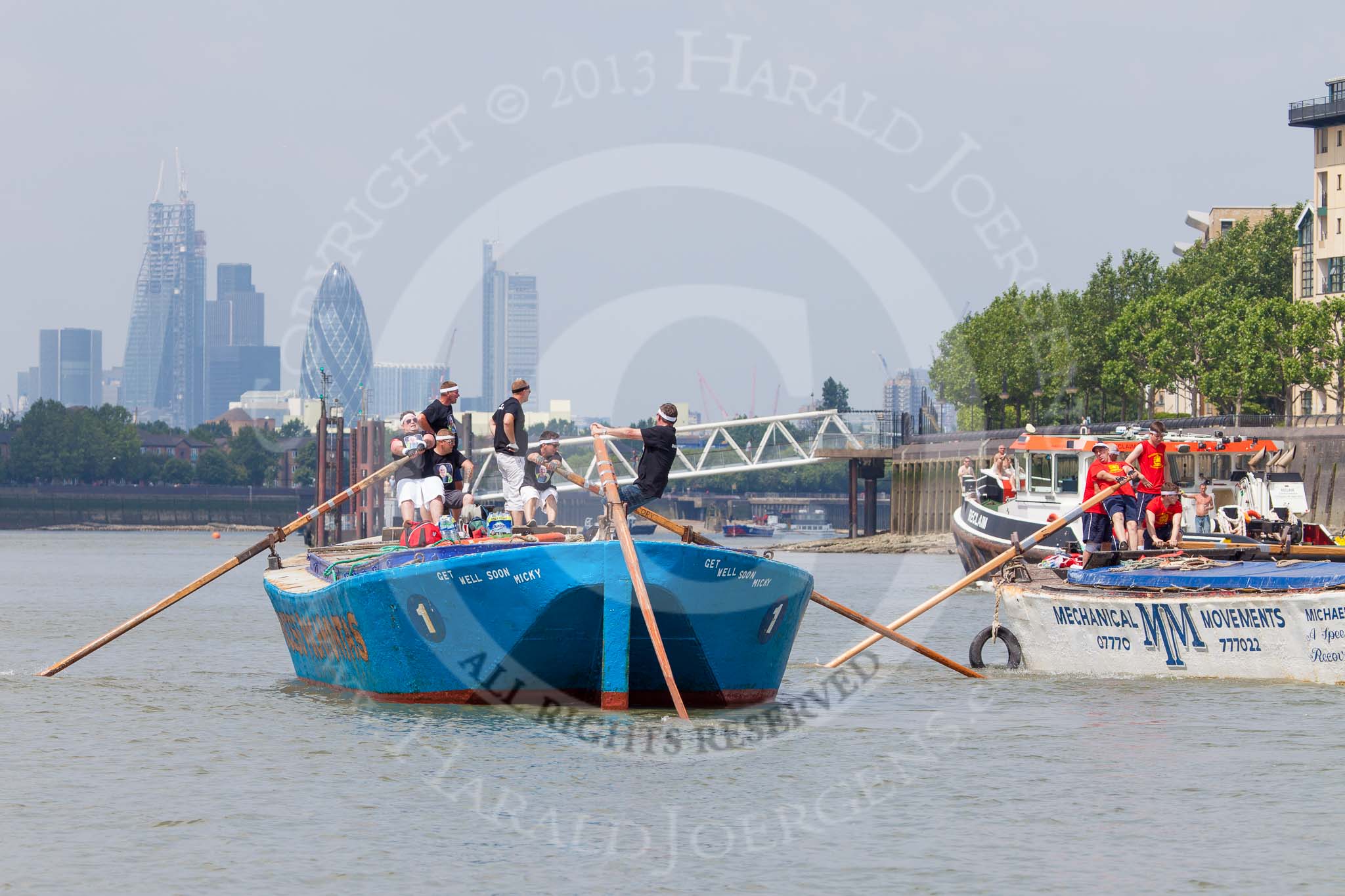 TOW River Thames Barge Driving Race 2013: Rear view of barge "Darren Lacey", by Princess Pocahontas, during the race, approaching Masthouse Terrace Pier. In the background the skyscrapers of the City of London, including the "Gherkin". On the right of "Darren Lacey" is barge "Spirit of Mountabatten", by Mechanical Movements and Enabling Services Ltd..
River Thames between Greenwich and Westminster,
London,

United Kingdom,
on 13 July 2013 at 12:42, image #178