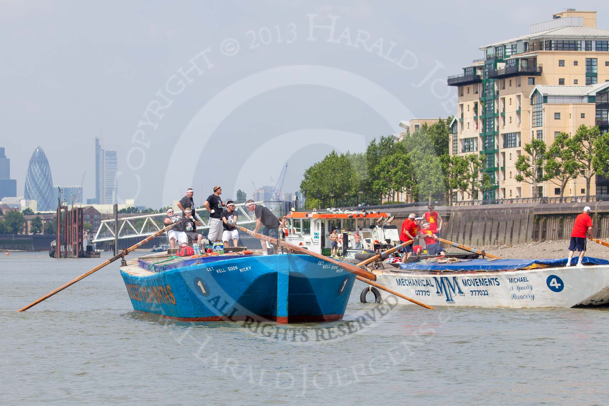 TOW River Thames Barge Driving Race 2013: Rear view of barge "Darren Lacey", by Princess Pocahontas, during the race, approaching Masthouse Terrace Pier. In the background the skyscrapers of the City of London, including the "Gherkin". On the right of "Darren Lacey" is barge "Spirit of Mountabatten", by Mechanical Movements and Enabling Services Ltd..
River Thames between Greenwich and Westminster,
London,

United Kingdom,
on 13 July 2013 at 12:42, image #180