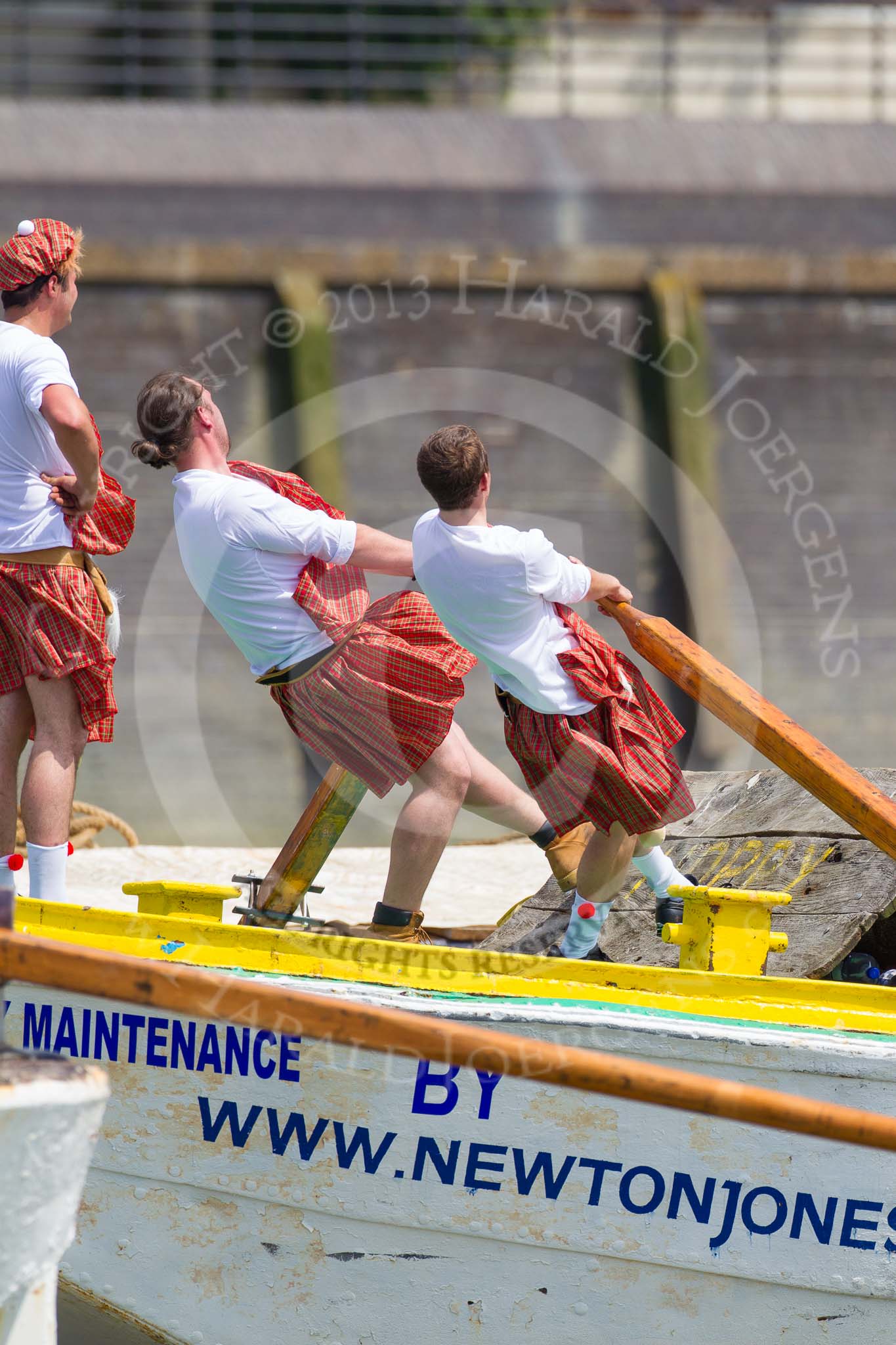 TOW River Thames Barge Driving Race 2013: Rowers wearing skirts on the deck of of barge "Hoppy" by GPS Fabrication..
River Thames between Greenwich and Westminster,
London,

United Kingdom,
on 13 July 2013 at 12:44, image #192