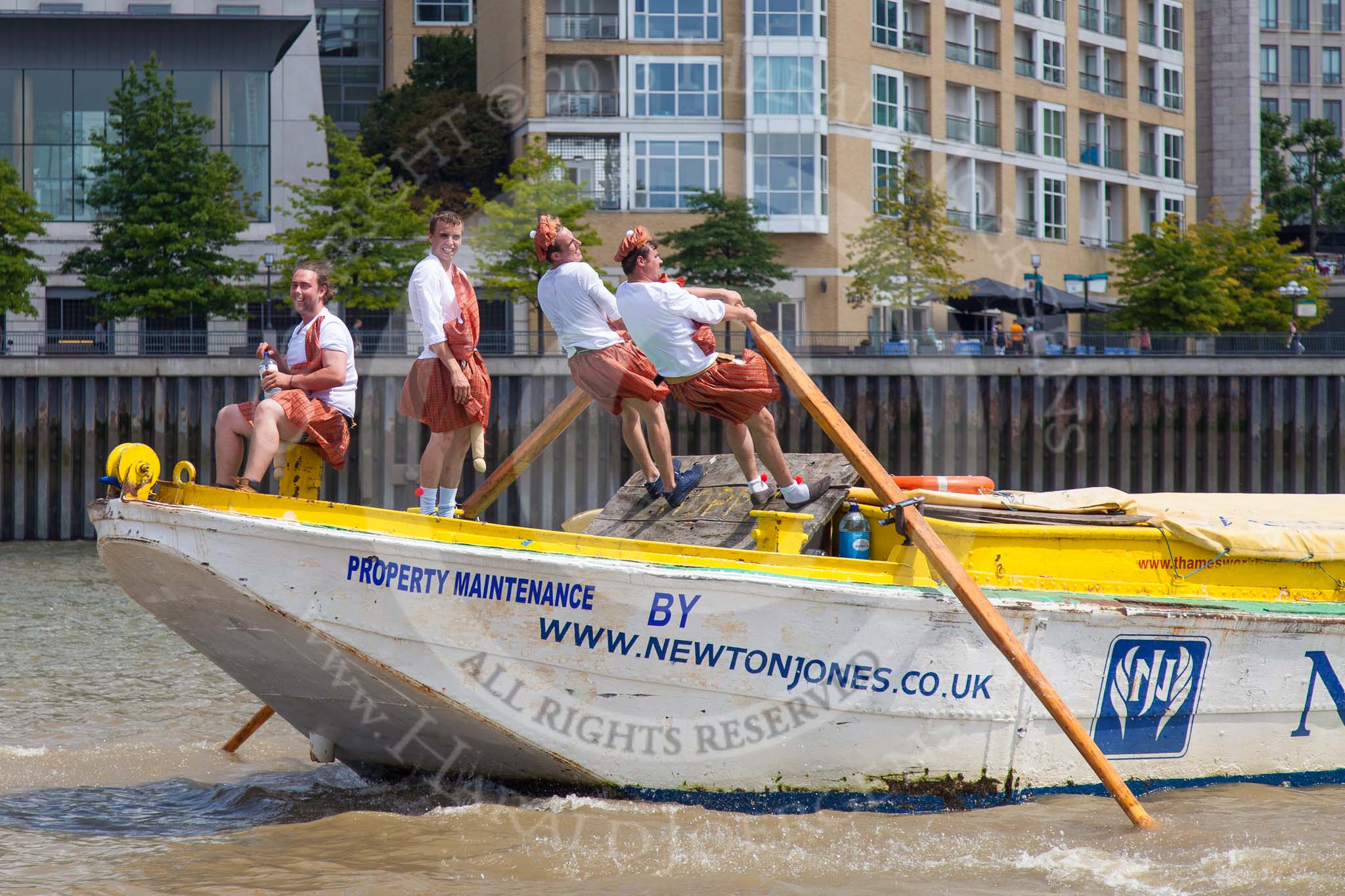 TOW River Thames Barge Driving Race 2013: Rowers in skirts on board of barge "Hoppy", by GPS Fabrication..
River Thames between Greenwich and Westminster,
London,

United Kingdom,
on 13 July 2013 at 13:15, image #301