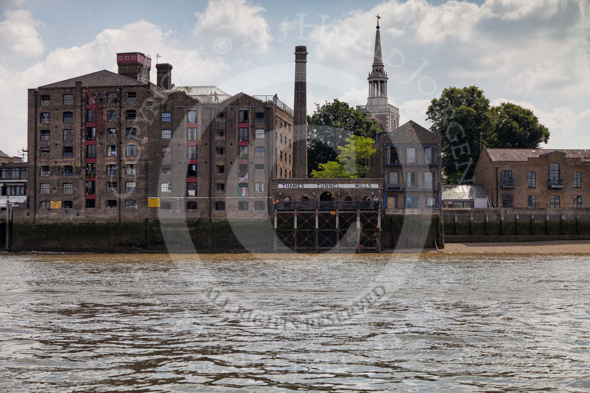 TOW River Thames Barge Driving Race 2013: Thames Tunnel Mill, a former warehouse converted to a residential building. In the background the spire od St Mary the Virgin..
River Thames between Greenwich and Westminster,
London,

United Kingdom,
on 13 July 2013 at 13:30, image #352