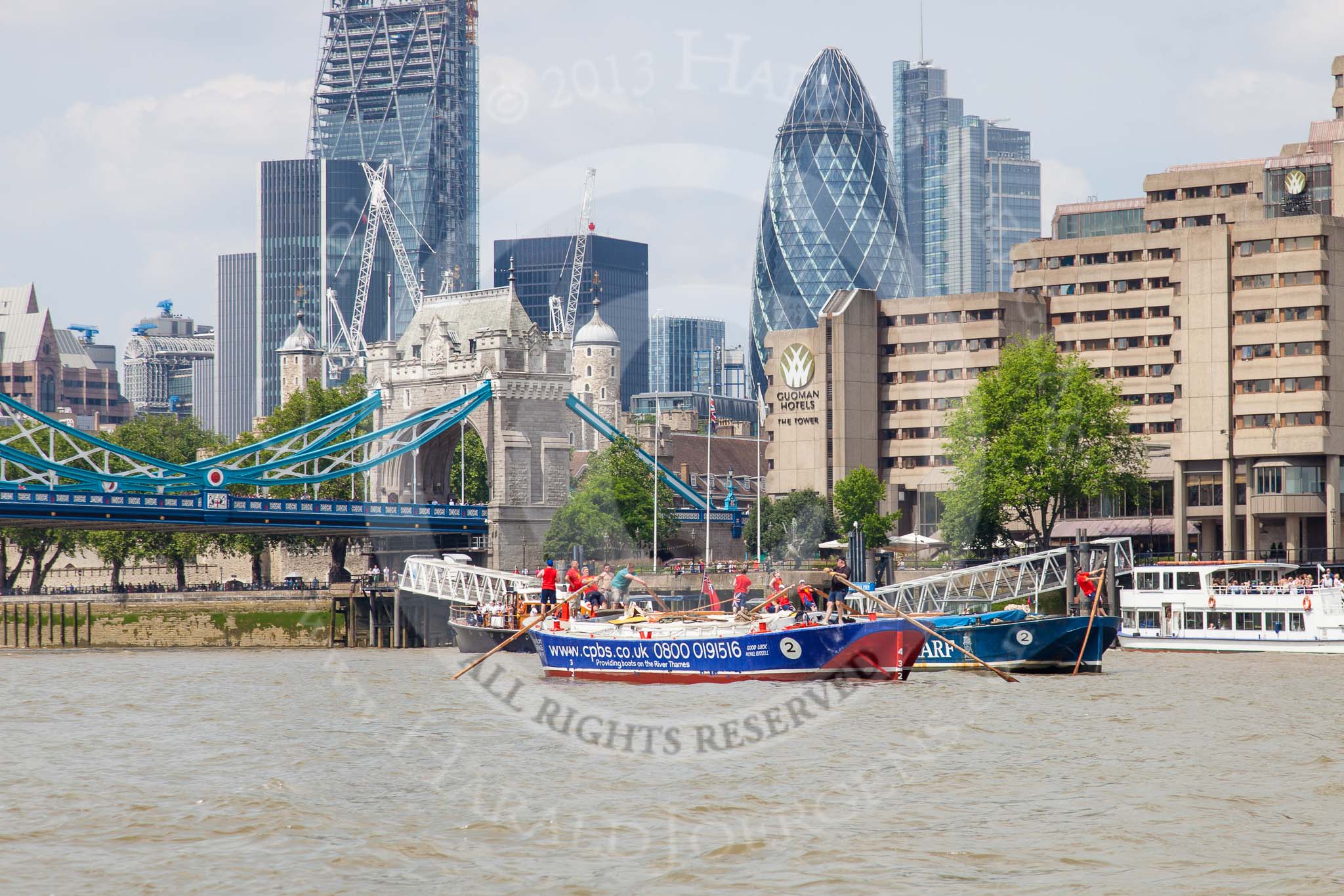 TOW River Thames Barge Driving Race 2013: Barge "Steve Faldo" by Capital Pleasure Boats, and barge "Diana", by Trinity Buoy Wharf, behind, approaching Tower Bridge, with the "Gherkin" building on the right..
River Thames between Greenwich and Westminster,
London,

United Kingdom,
on 13 July 2013 at 13:40, image #377