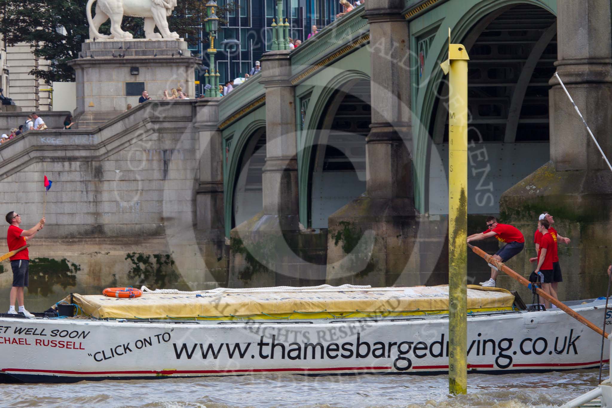 TOW River Thames Barge Driving Race 2013: Barge ""Shell Bay" by South Dock Marina,  crosses the finish of the race at Westminster Bridge..
River Thames between Greenwich and Westminster,
London,

United Kingdom,
on 13 July 2013 at 14:24, image #449